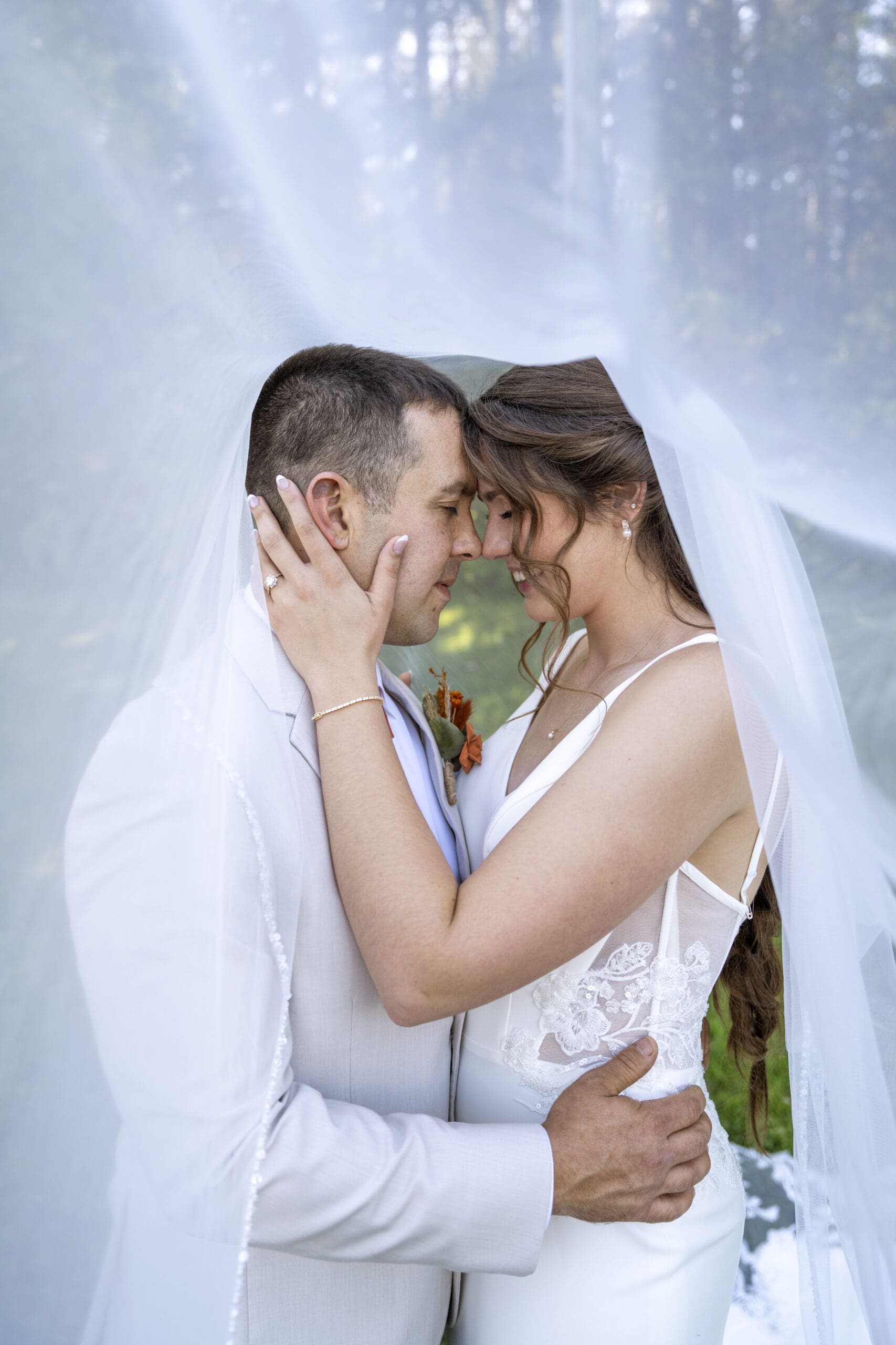 Groom and Bride sharing a moment.