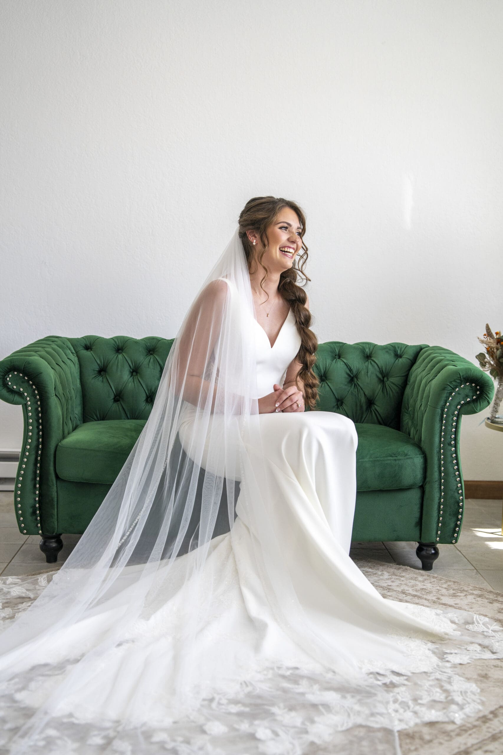 Bride smiling out the window at The Bailiwick.