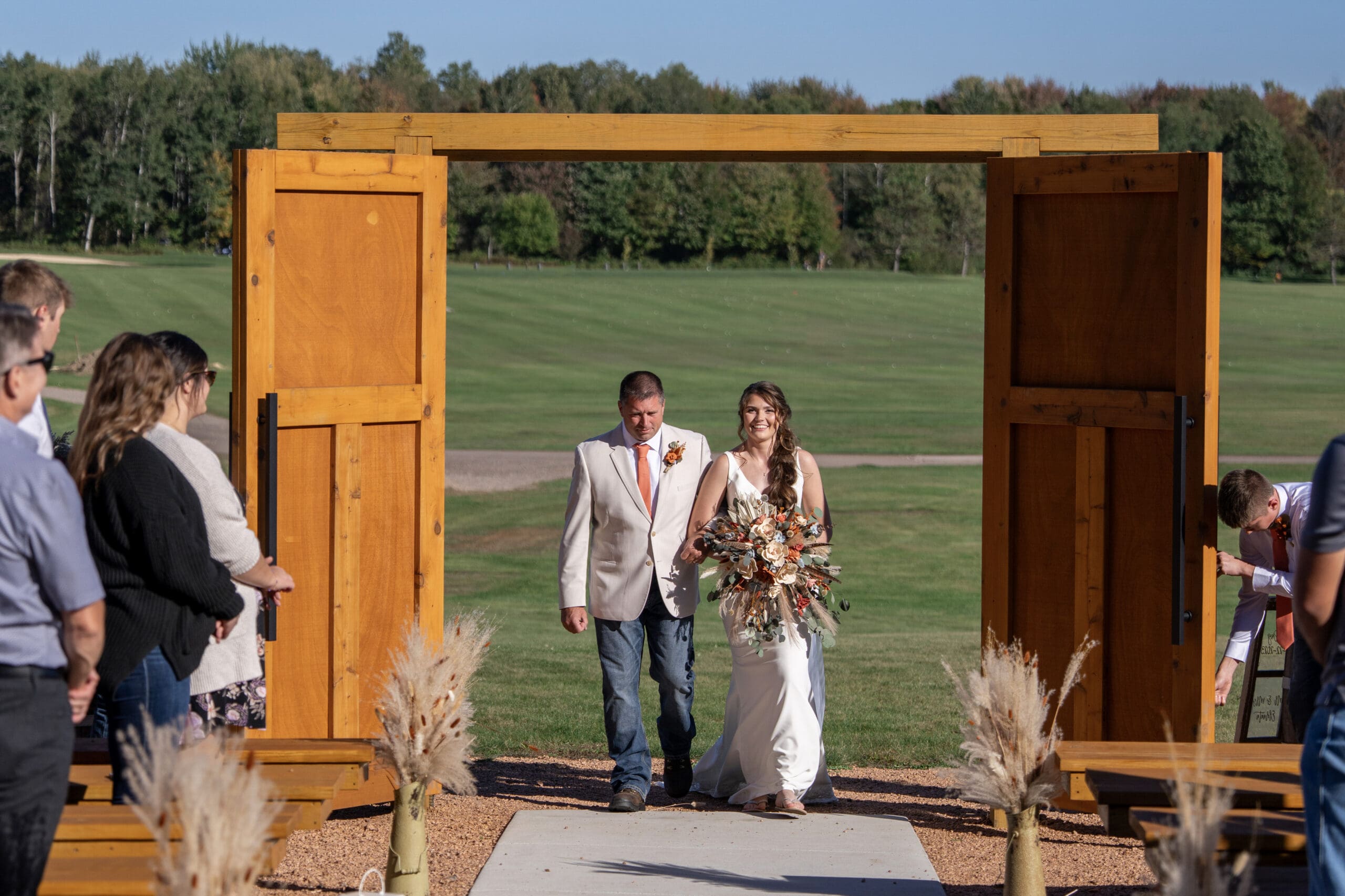 The bride and her father walking down the aisle in Meford, WI.