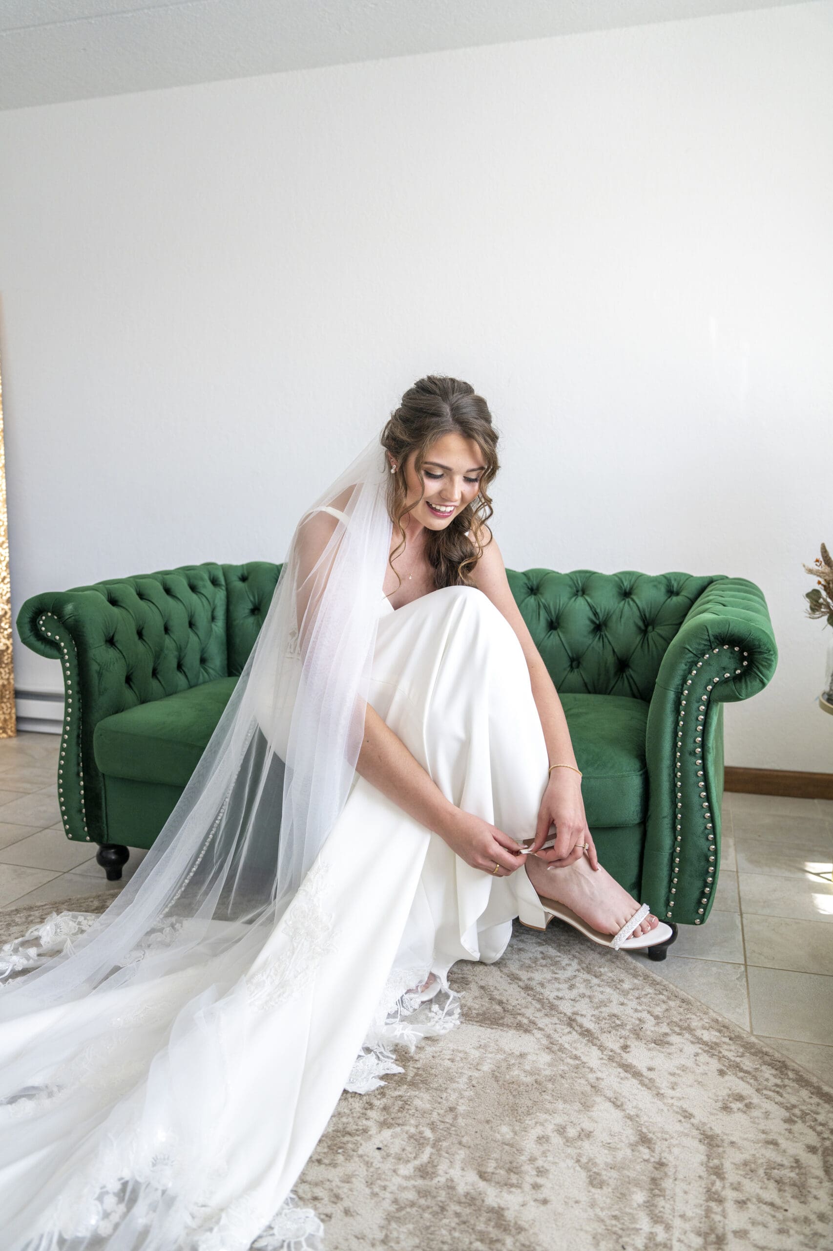 Bride putting on her heels.