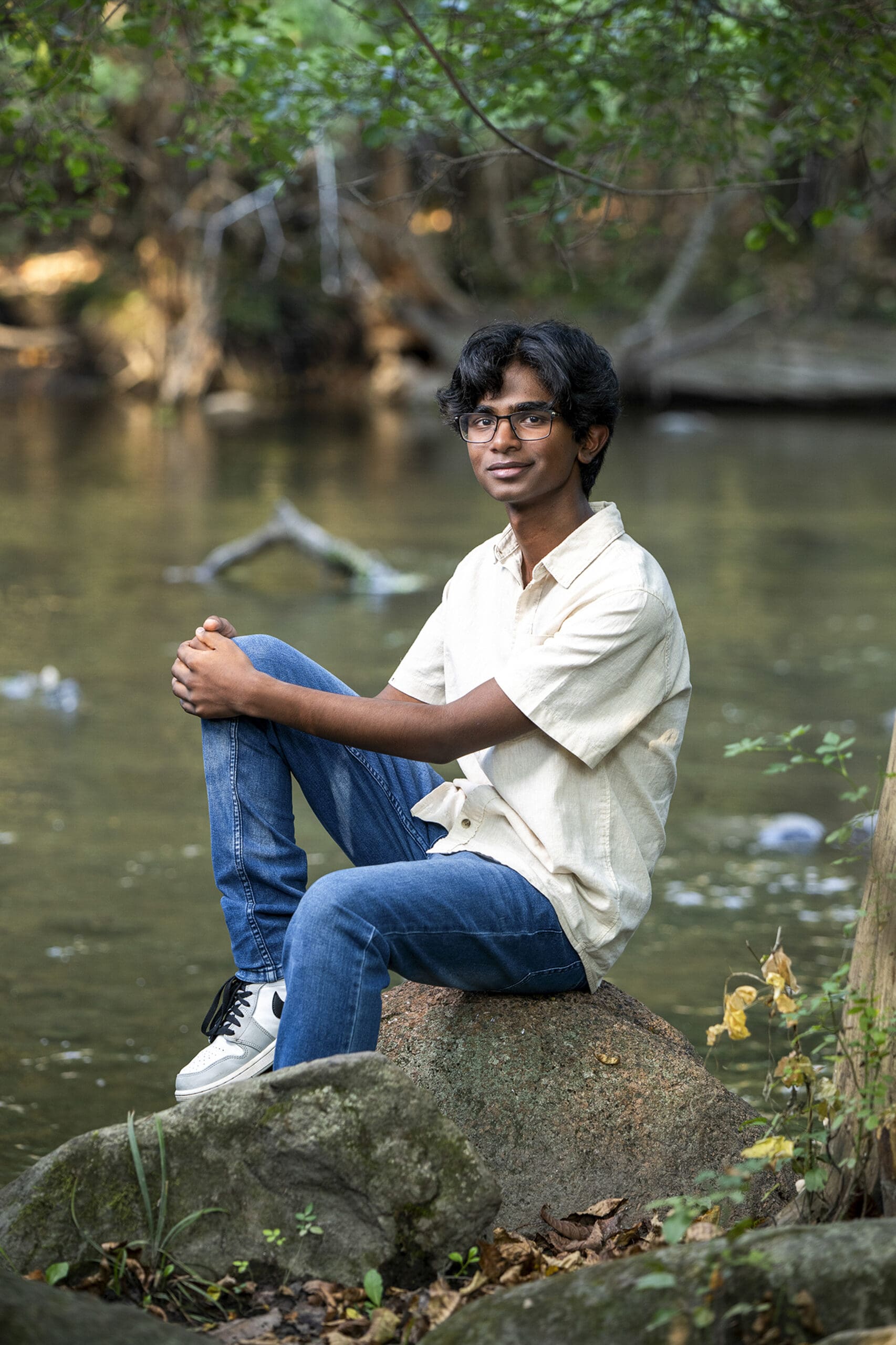 Arrowhead senior guy sitting by Bark River. 