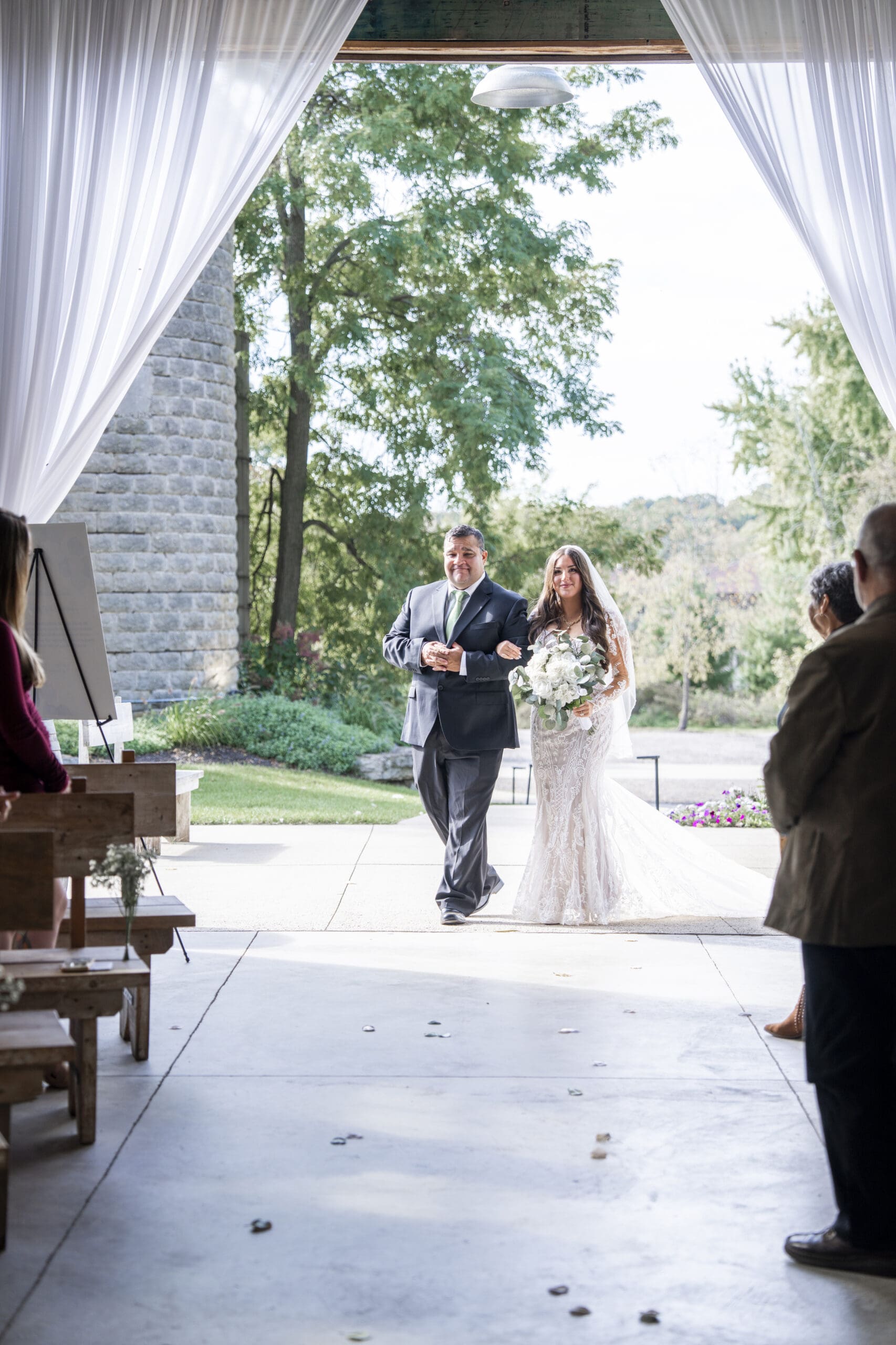Bride walking down the aisle at Lilac Acres wedding venue in Wisconsin