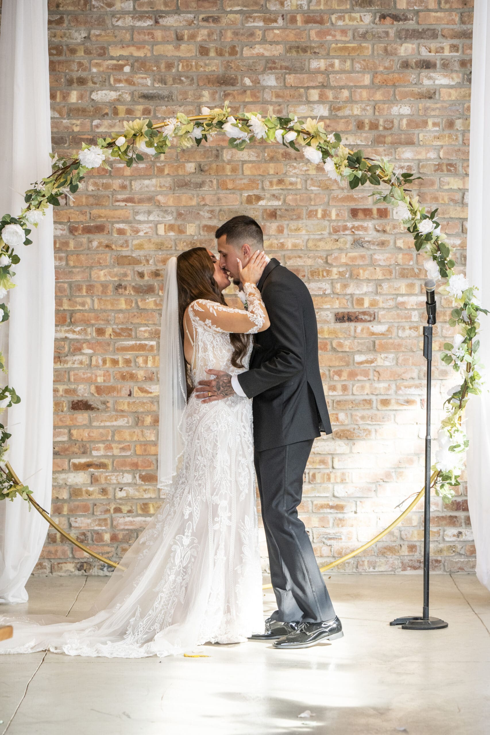First kiss as newlyweds at Lilac Acres wedding venue