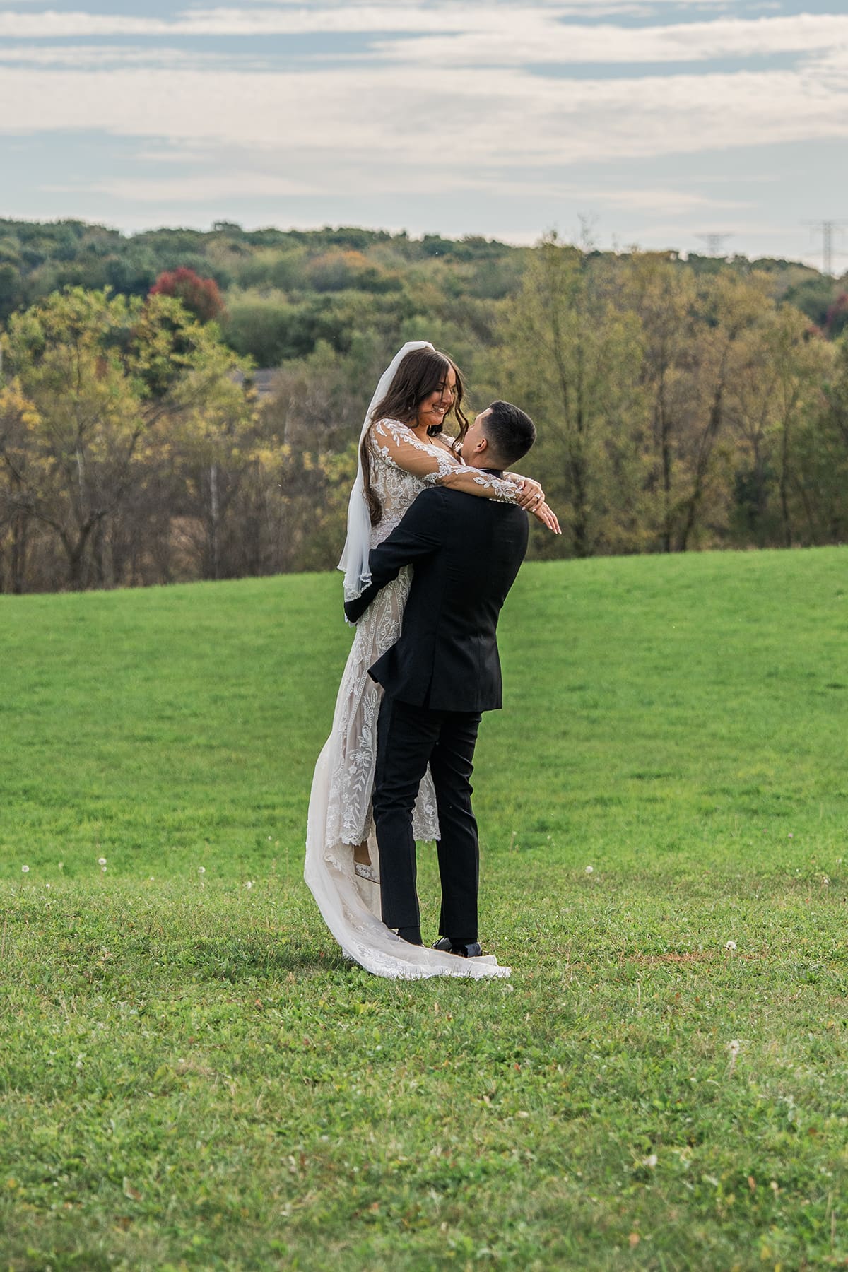 Wedding couple surrounded by natural scenery at Lilac Acres wedding venue in Wisconsin