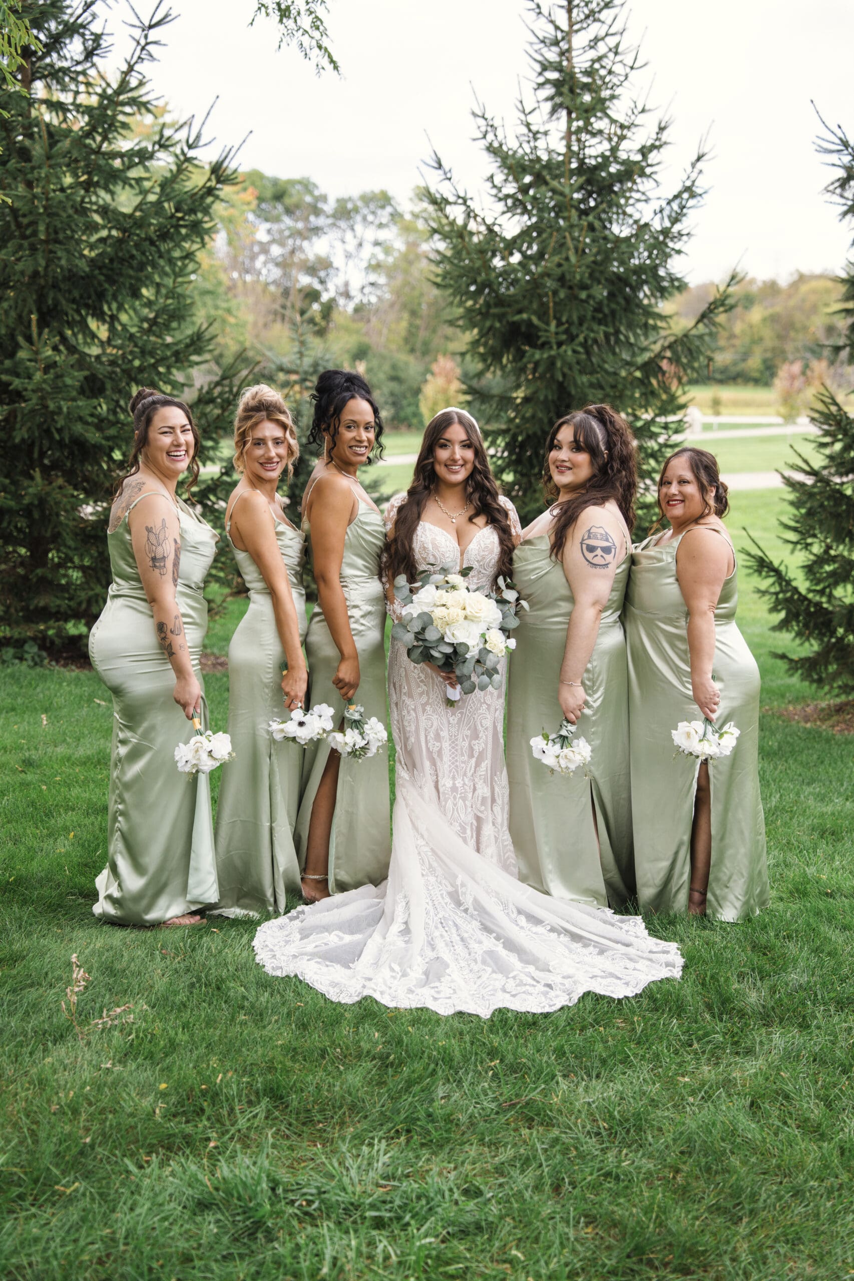 Bride and her bridesmaids posing for portraits