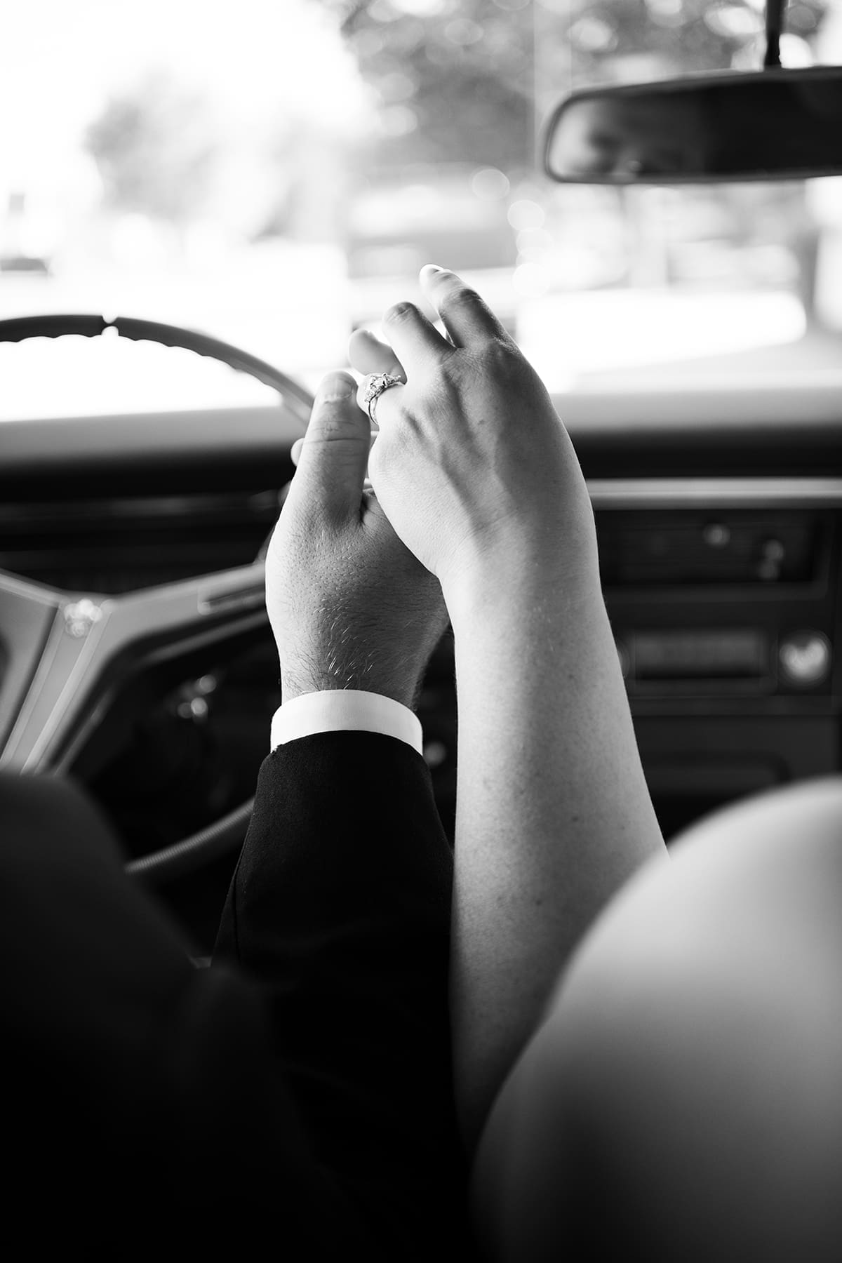 Close up of WI bride and groom holding hands