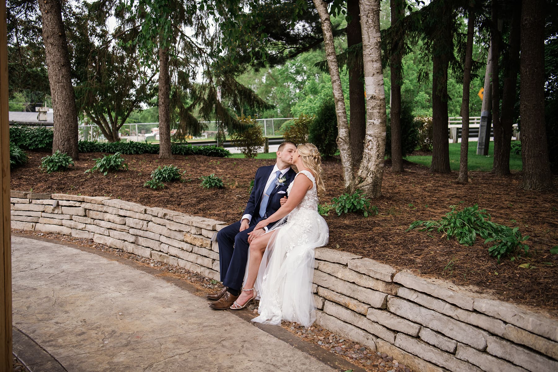 Couple sitting outside and kissing 