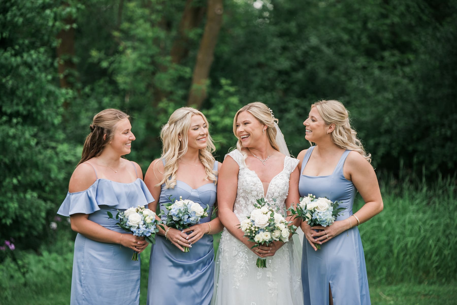 Delafield bride laughing with her bridesmaids