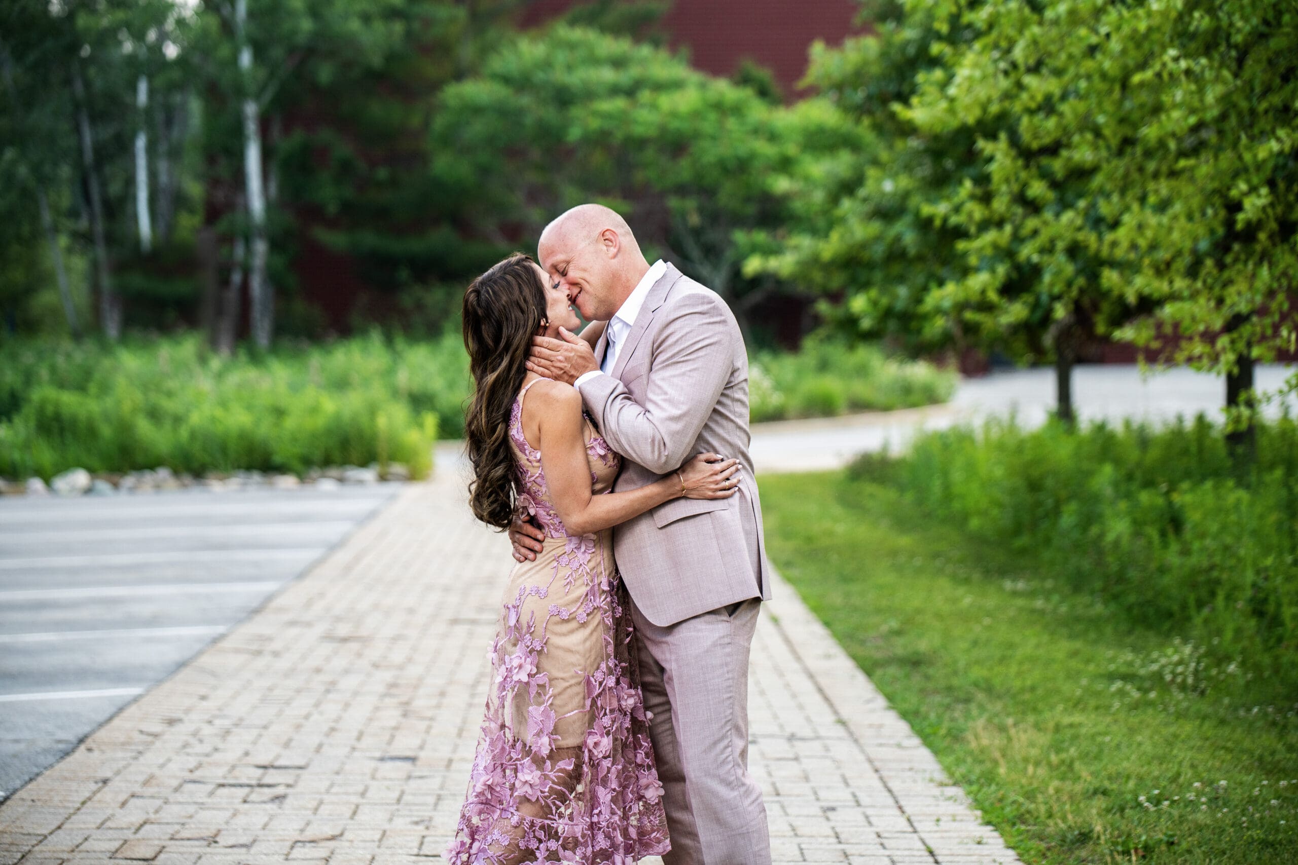 Delafield couple kissing on the sidewalk during their photo session