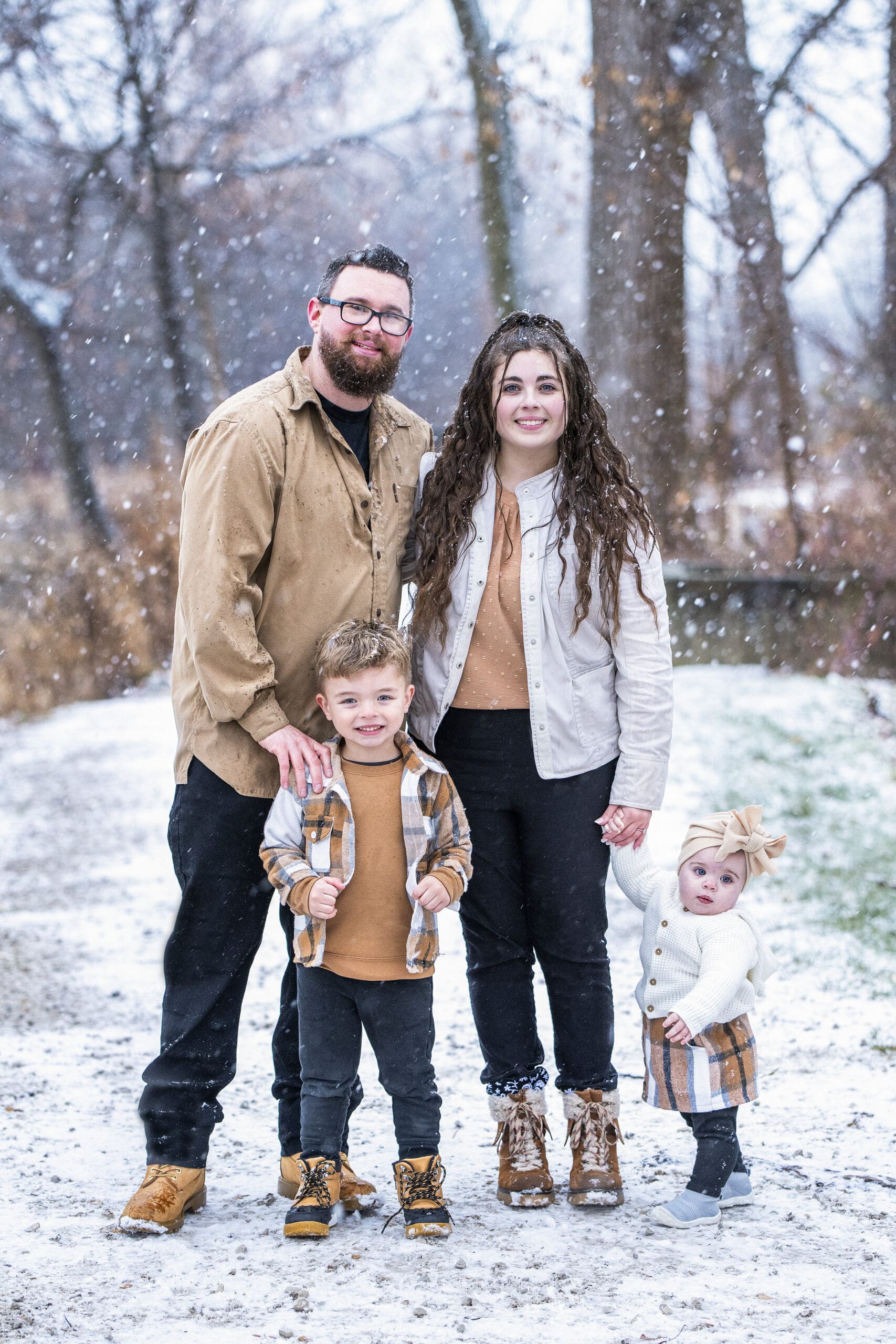 Soft textures and layers shown as  family photo outfit ideas for winter sessions in Delafield. 