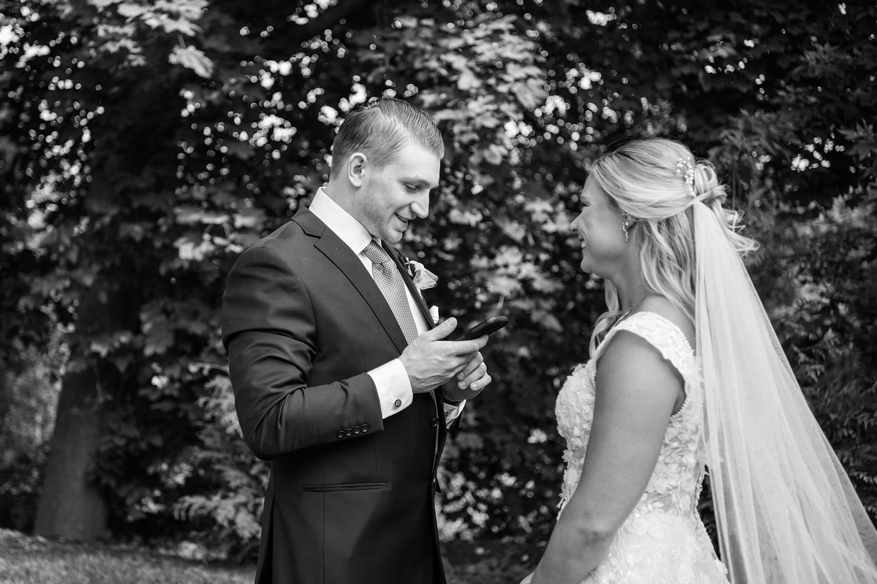 Delafield bride smiling as groom reads private vows 