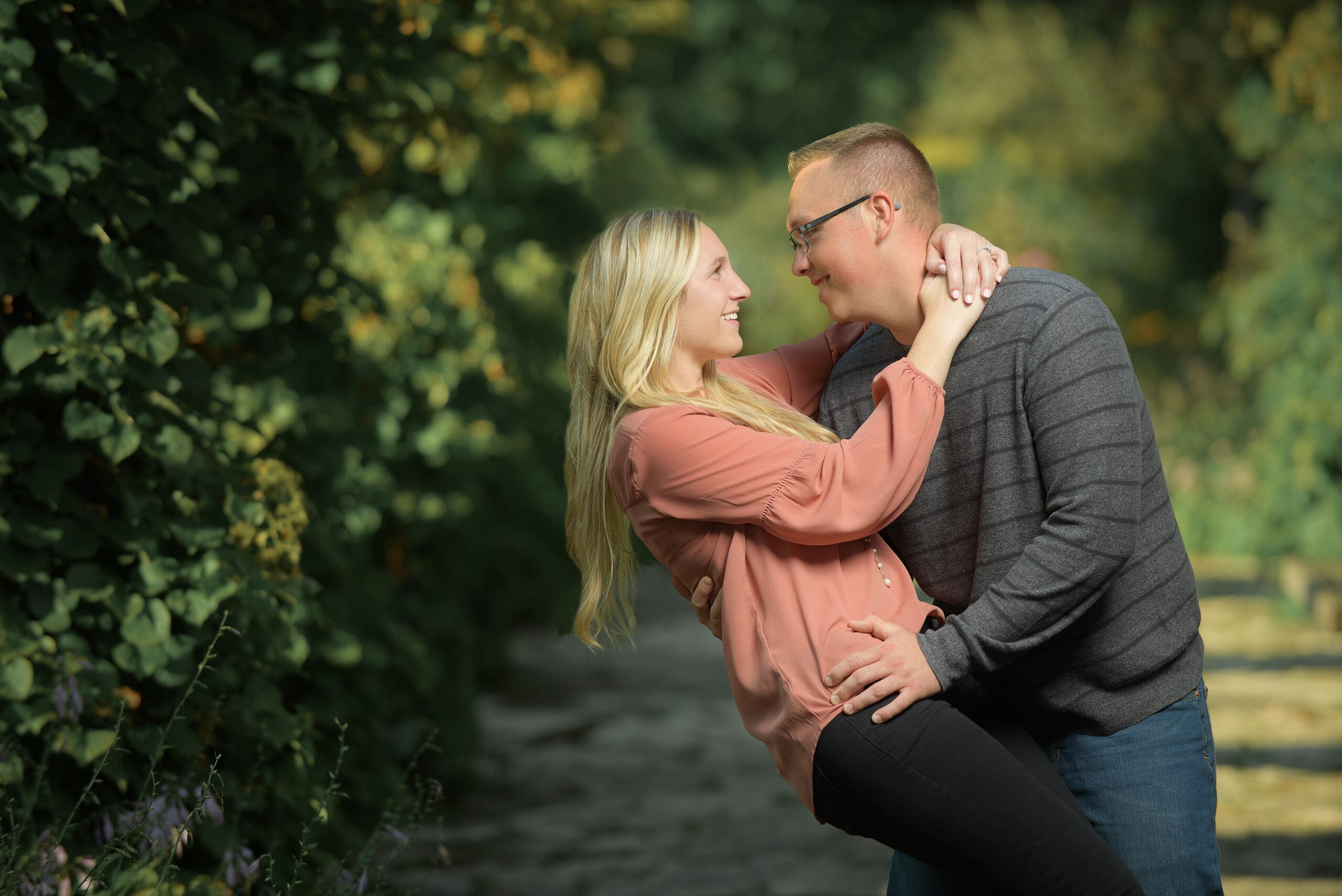 Engaged couple dipping at Frame Park in Waukesha 