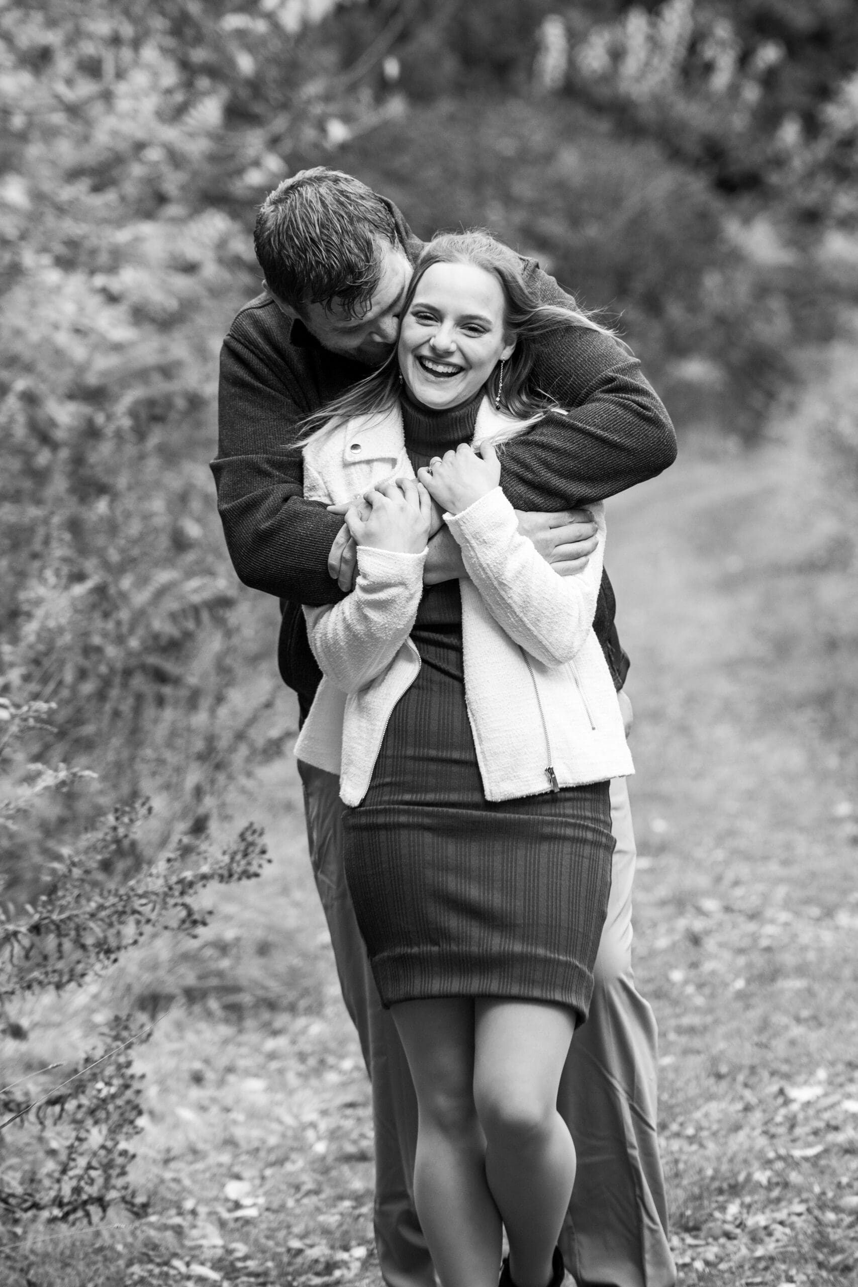 Couple laughing naturally during a session that demonstrates how to prepare for an engagement session in Wisconsin