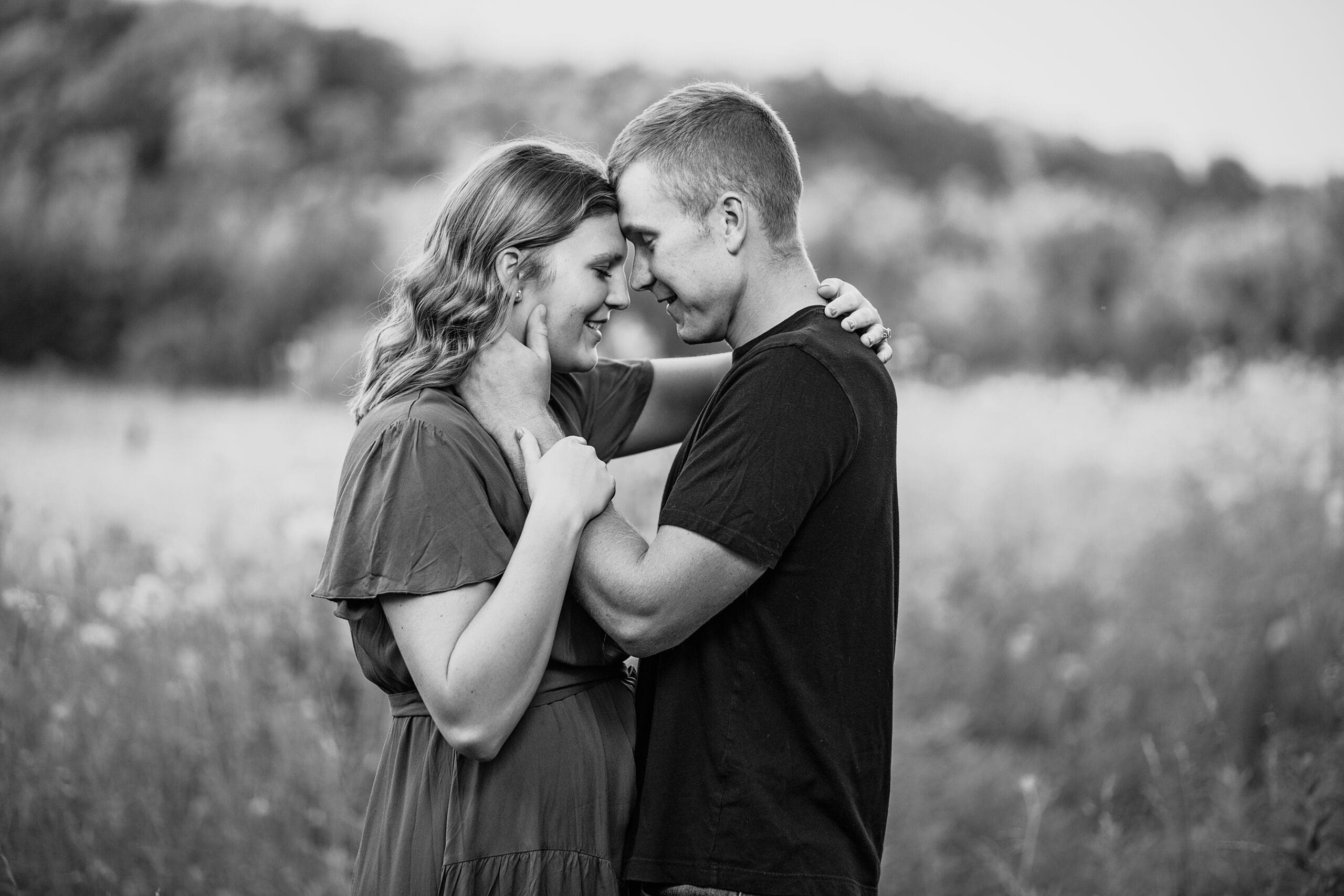Milwaukee couple leaning their heads together during their engagement session