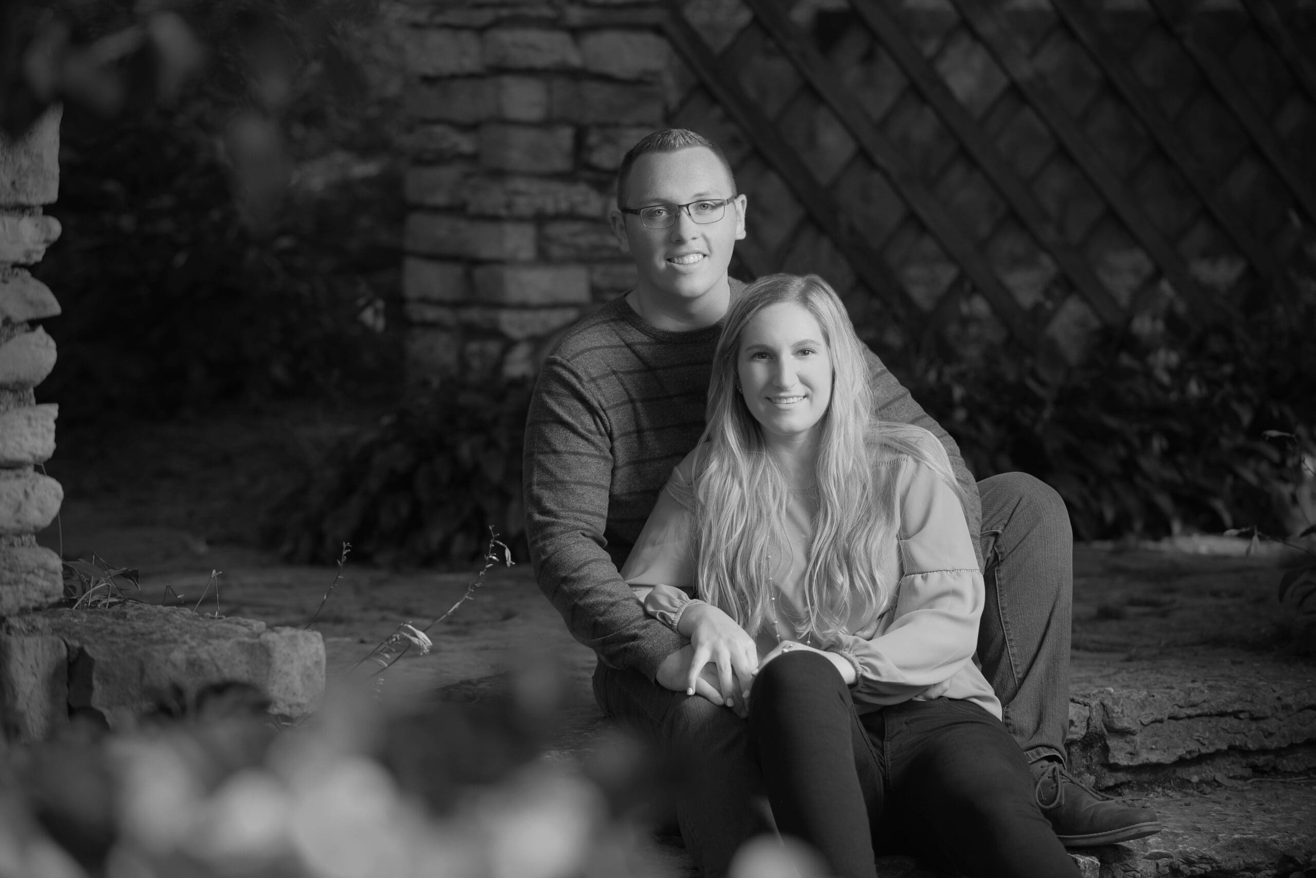 Spring engagement photos in Waukesha County with fresh greenery
