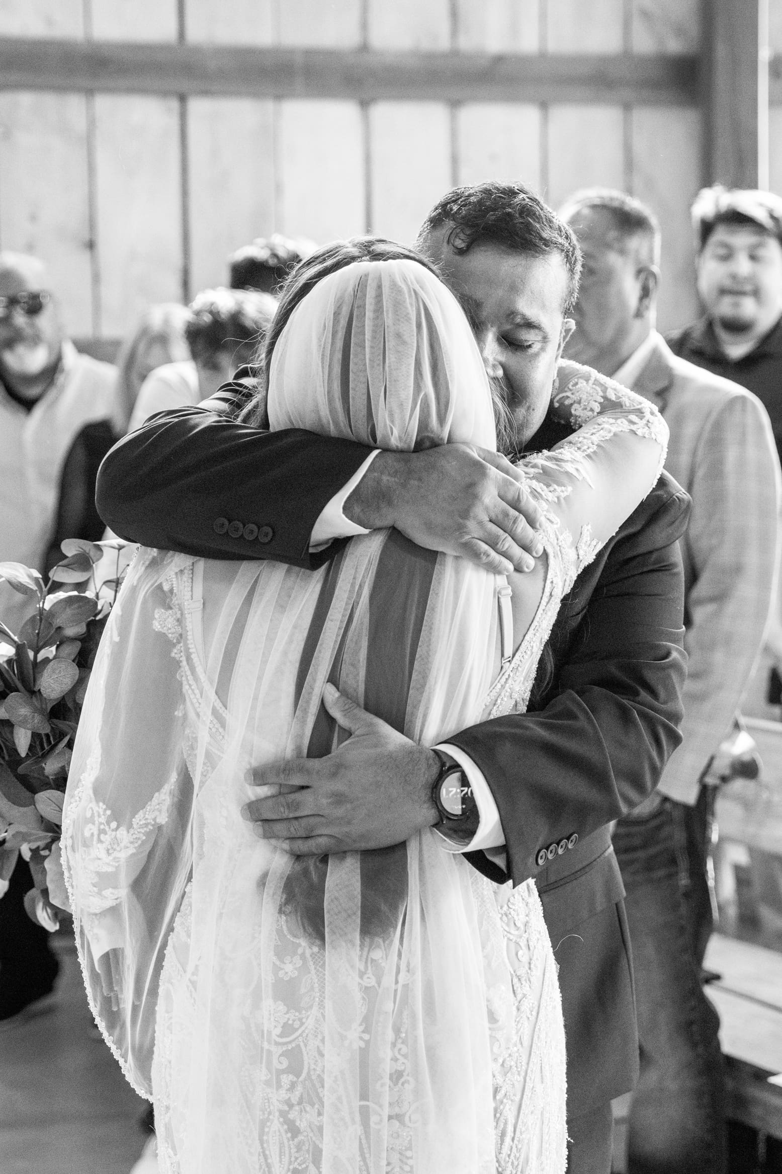 Father hugging his daughter at the Wisconsin wedding ceremony 
