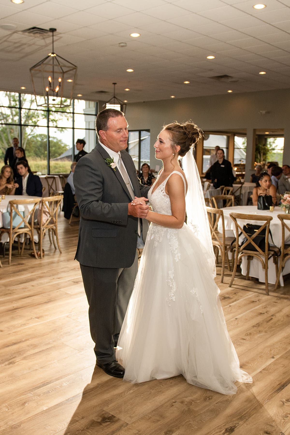 Father and daughter sharing first dance at wedding 