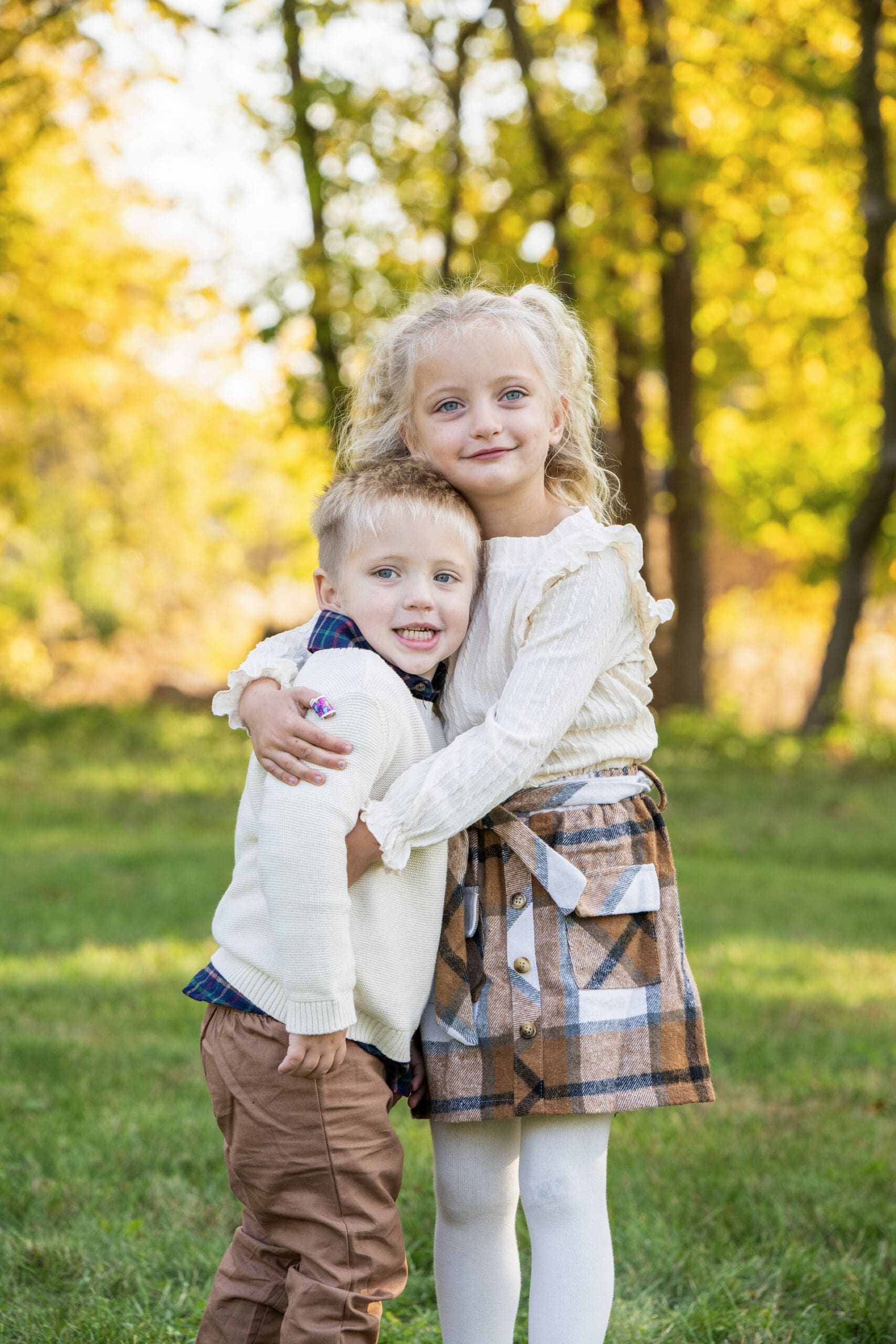 Girl hugging her brother in Delafield during family photo session