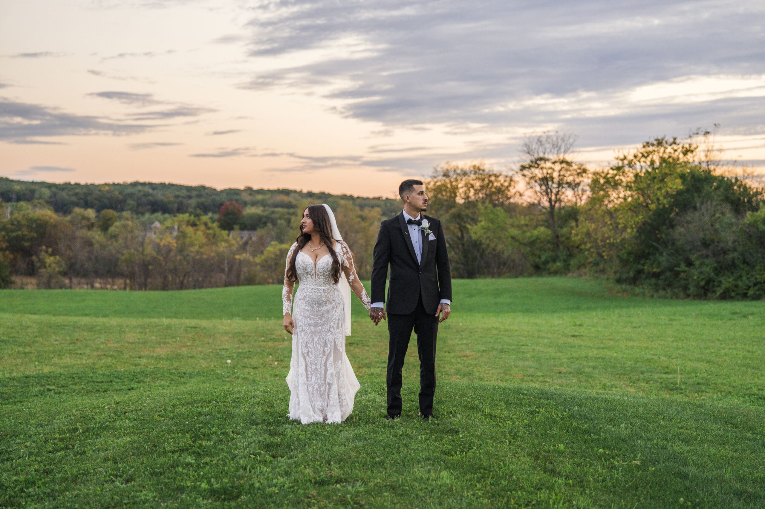 Newly weds posing in field during sunset in Waukesha 