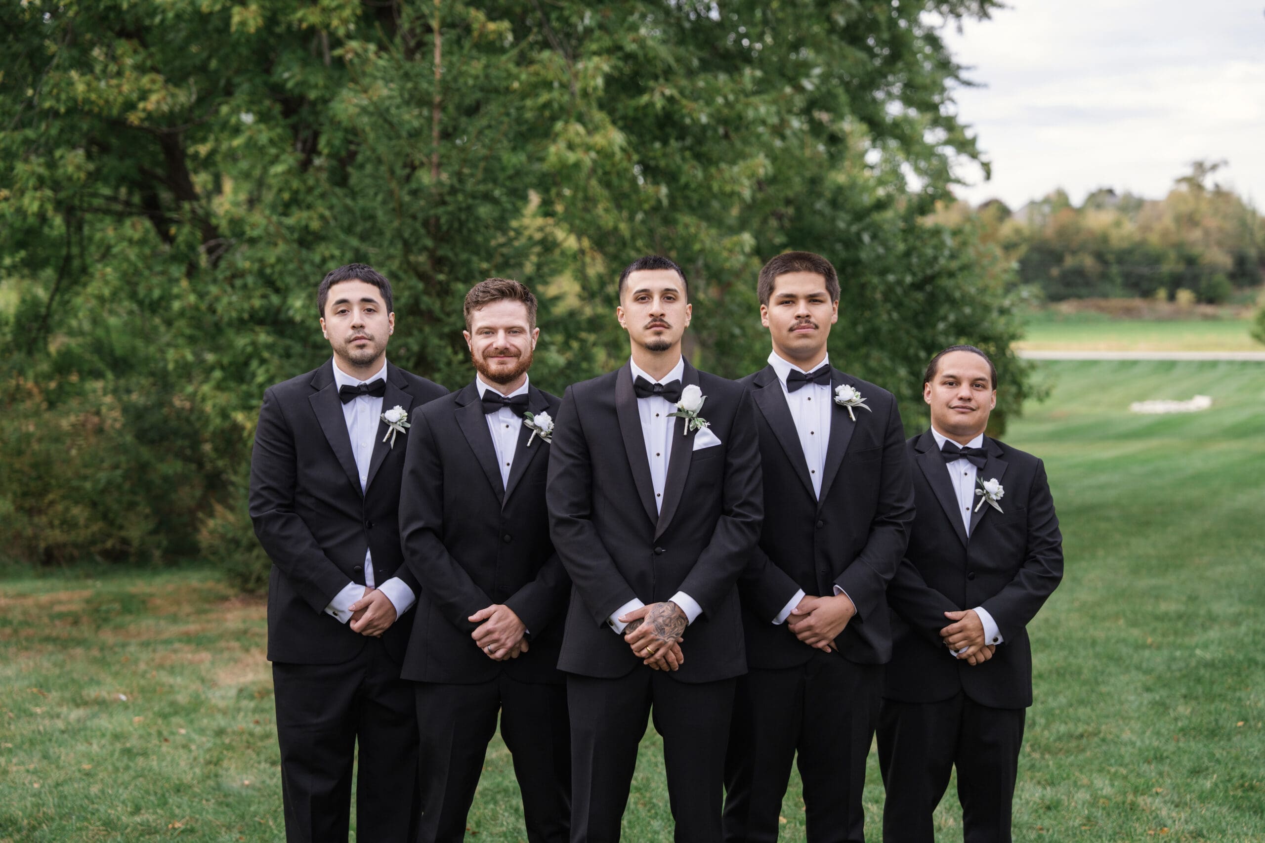 Groom and groomsmen portrait at Lilac Acres wedding venue in Wisconsin