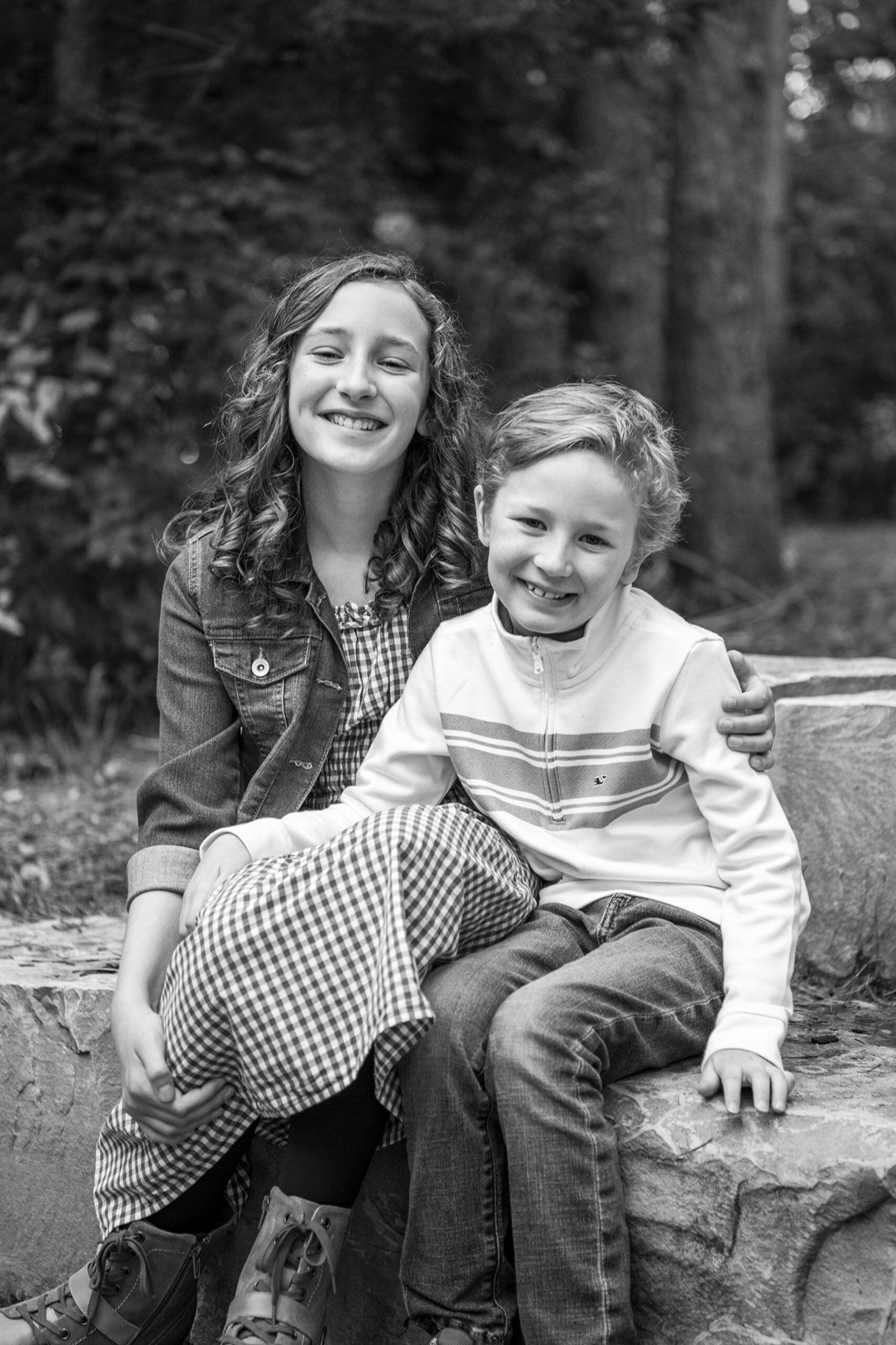 Hartland brother and sister smiling for their family portait session.