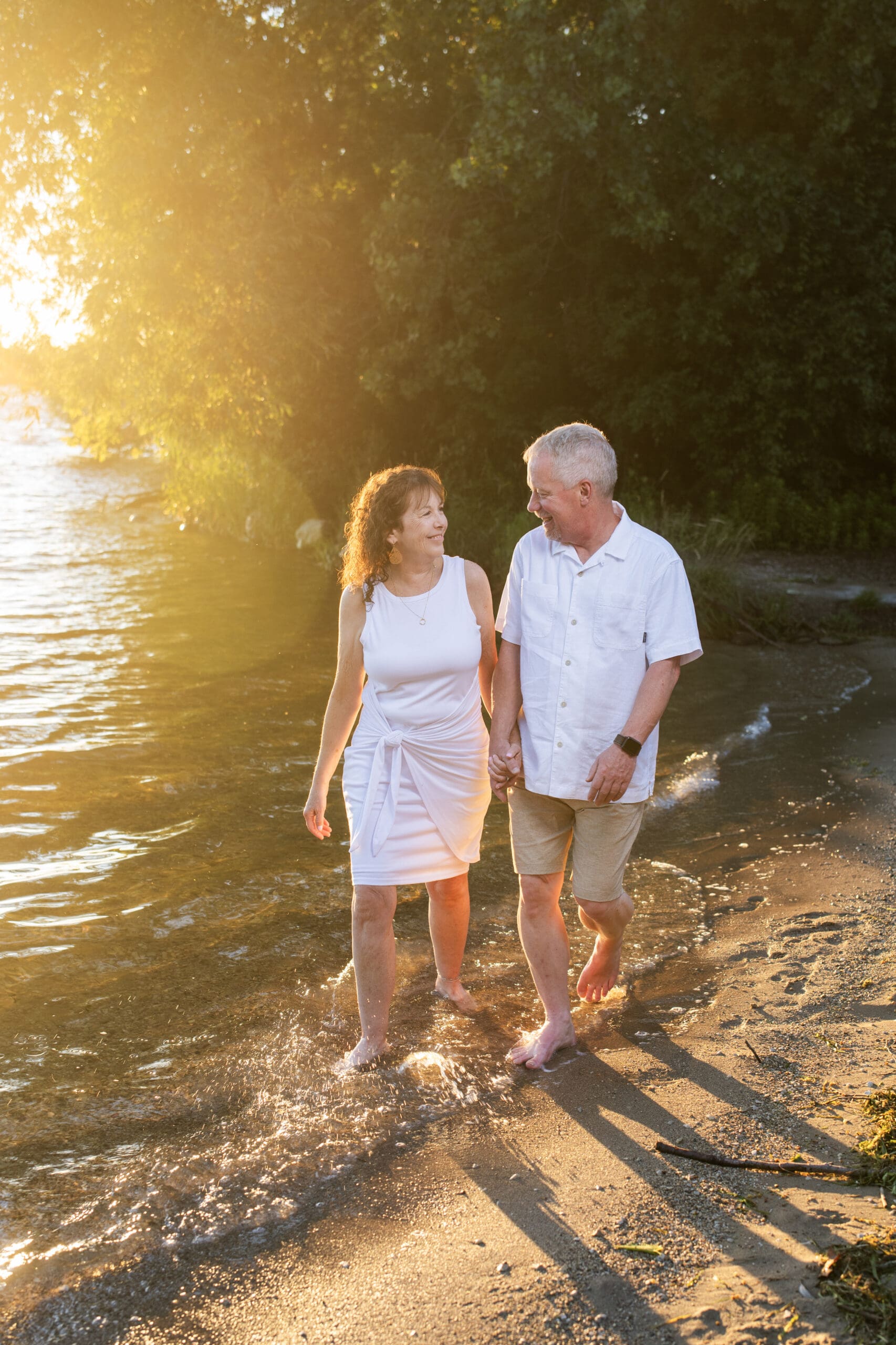 Hartland couple walking on beach at Naga-Waukee Park 