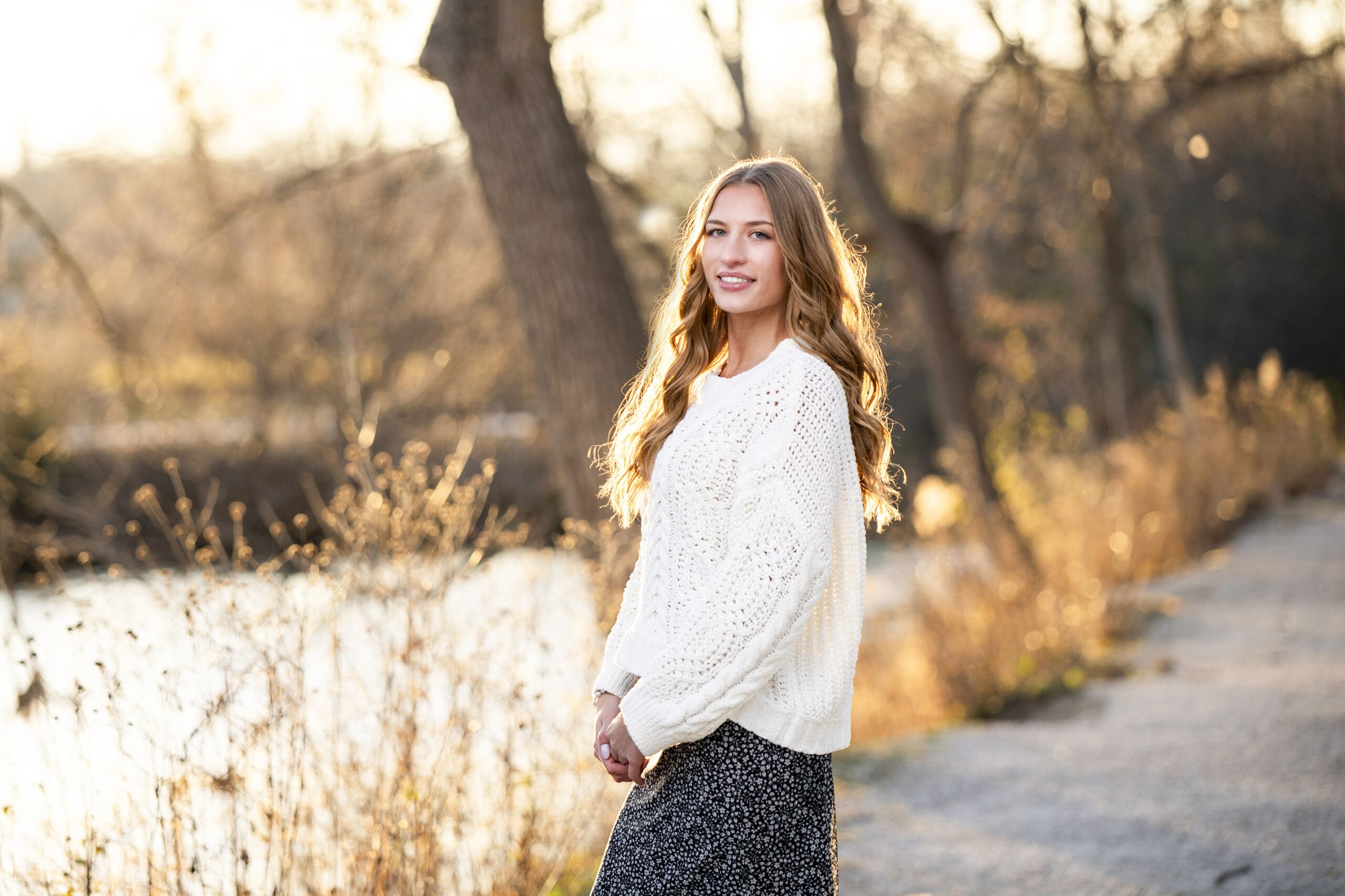 Hartland senior standing on path in Delafield. 