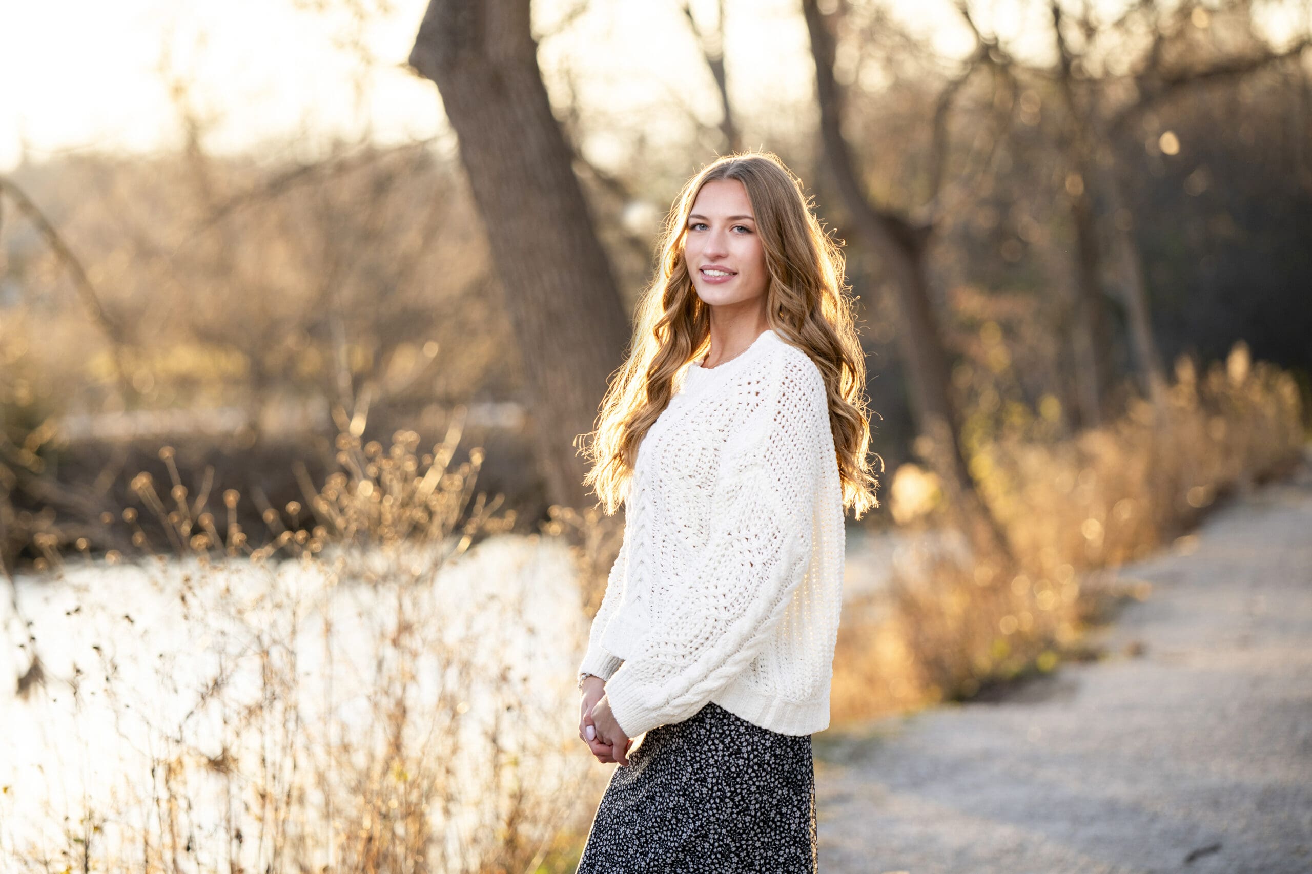 High school senior girl posing at the Fish Hatchery in Delafield during golden hour — best time to take senior pictures.