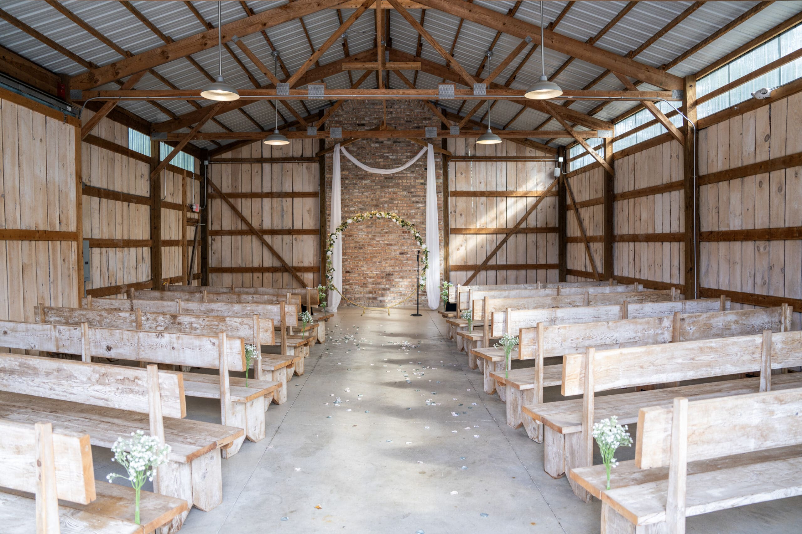 Indoor wedding ceremony at Lilac Acres wedding venue