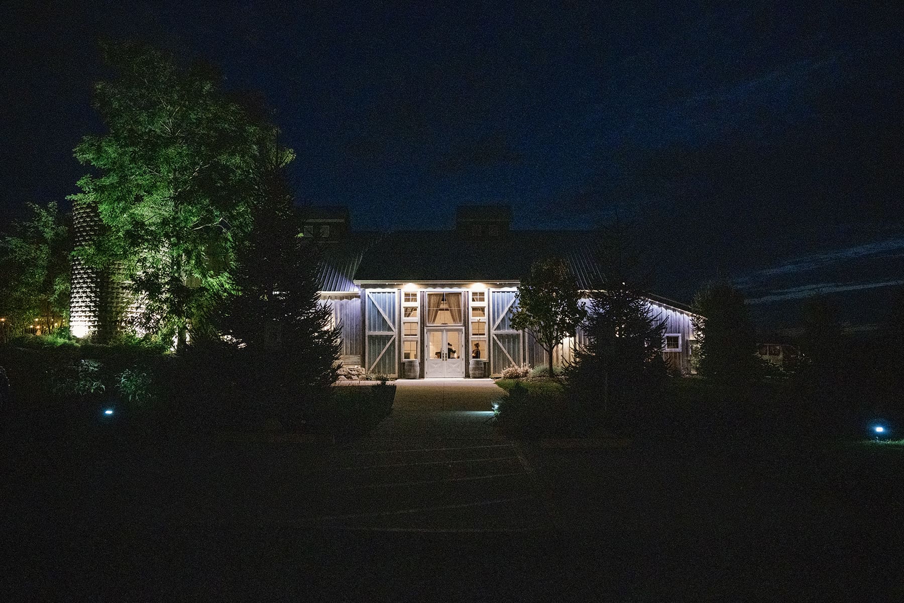 Lilac Acres barn lite up at night during wedding reception 