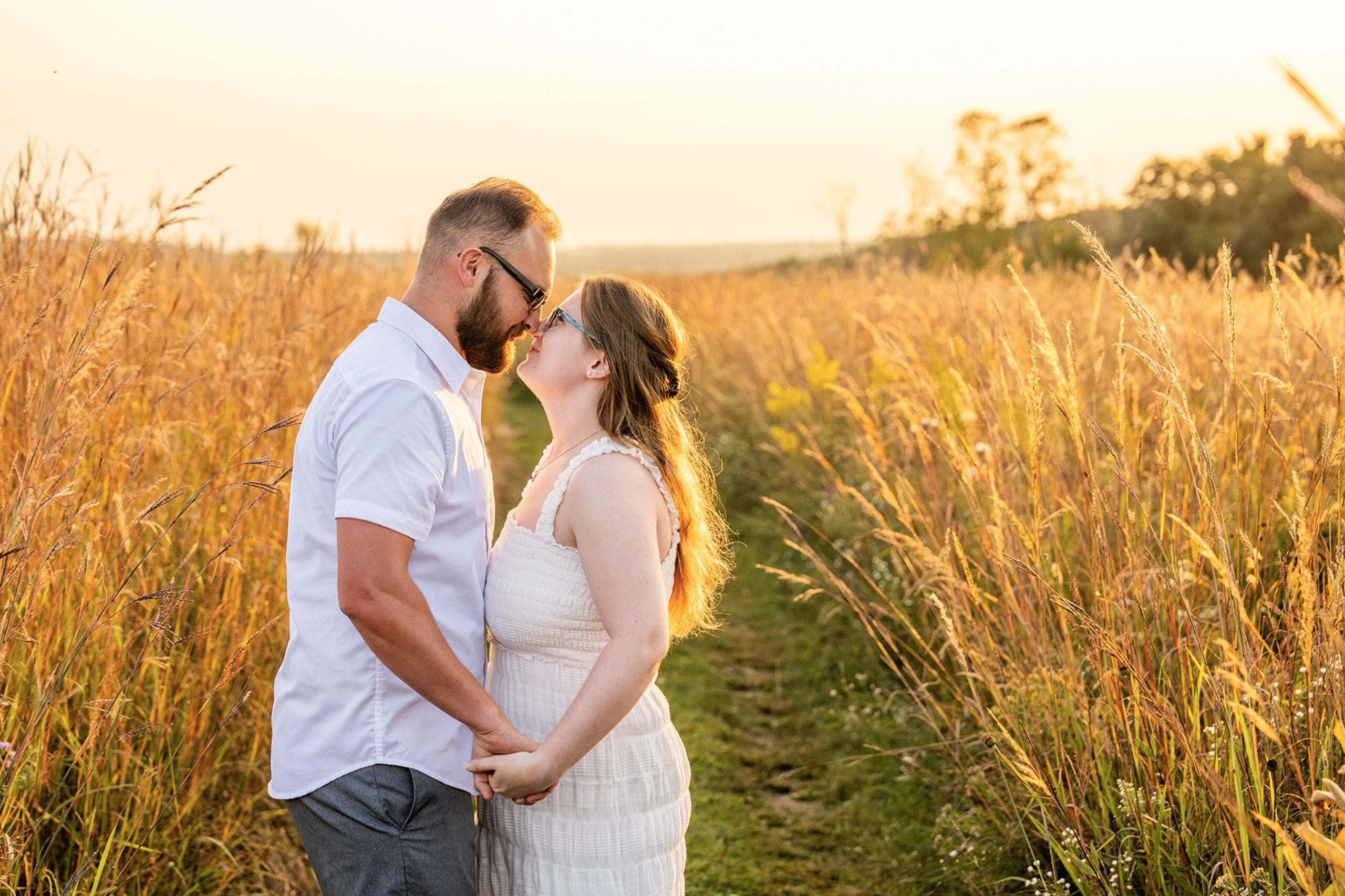 Milwaukee couple smiling during golden hour at Retzer Nature Center