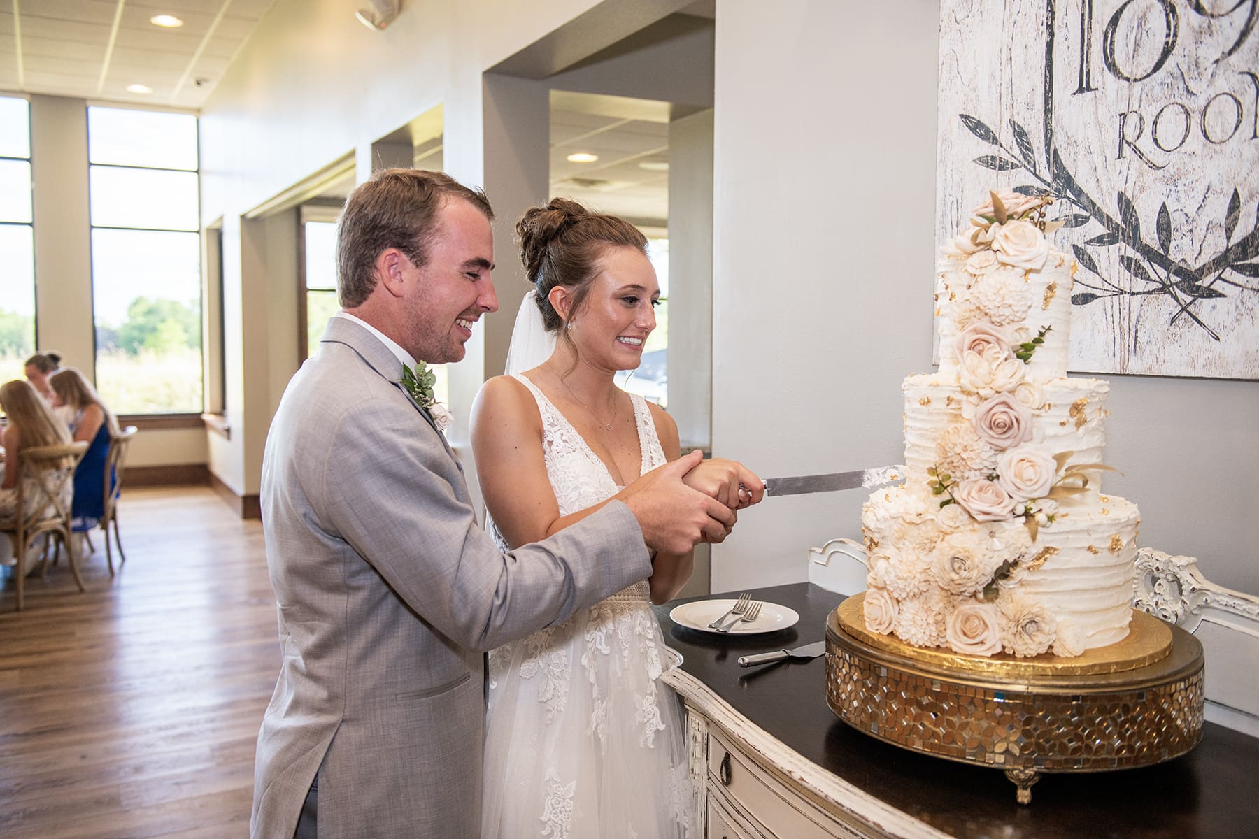 Married couple cutting cake as husband and wife