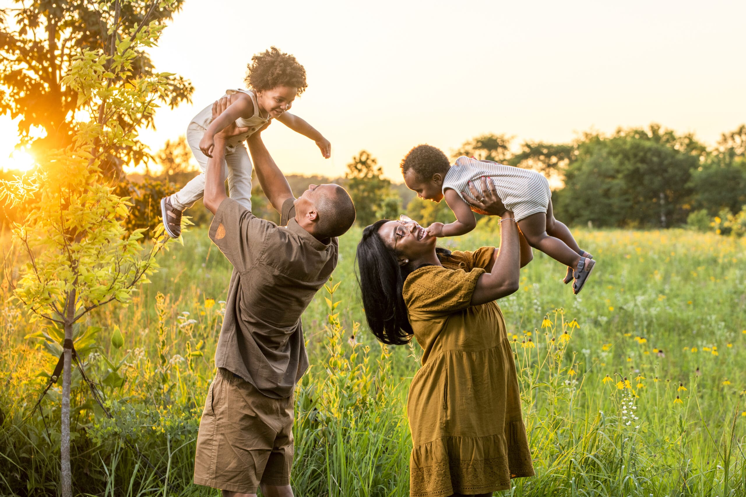 Oconomowoc family playing with their children during family photo session