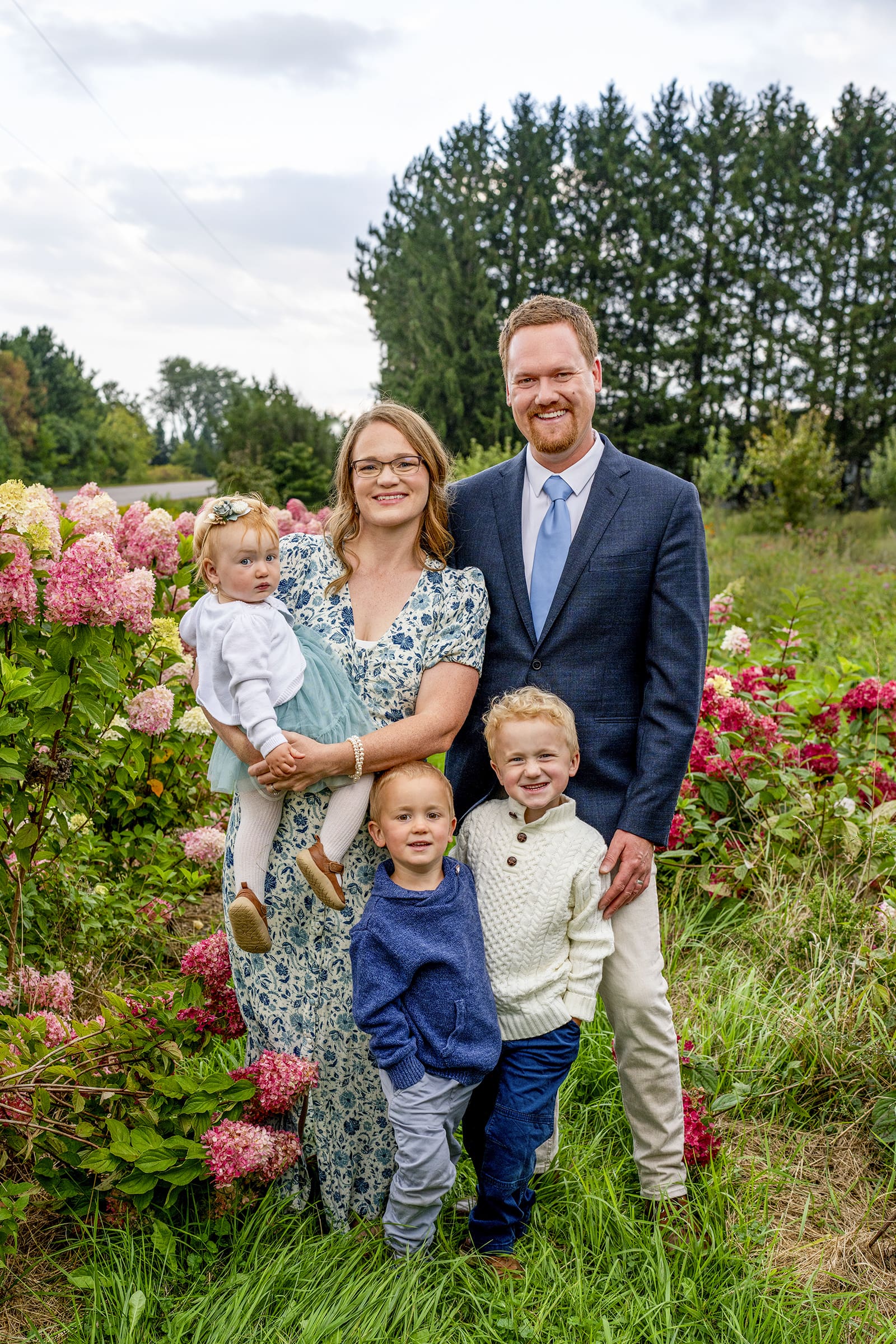 Hartland family posing for the camera in a flower field in Oconomowoc. 