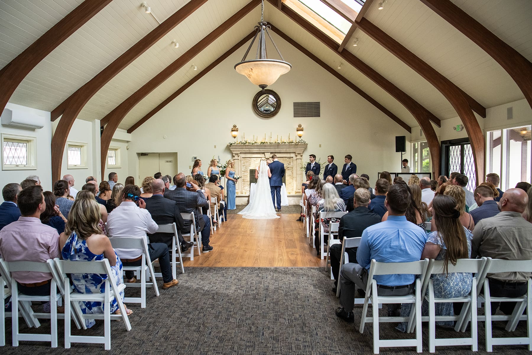 Bride and groom at alter during Rustic Circle Inn wedding ceremony 