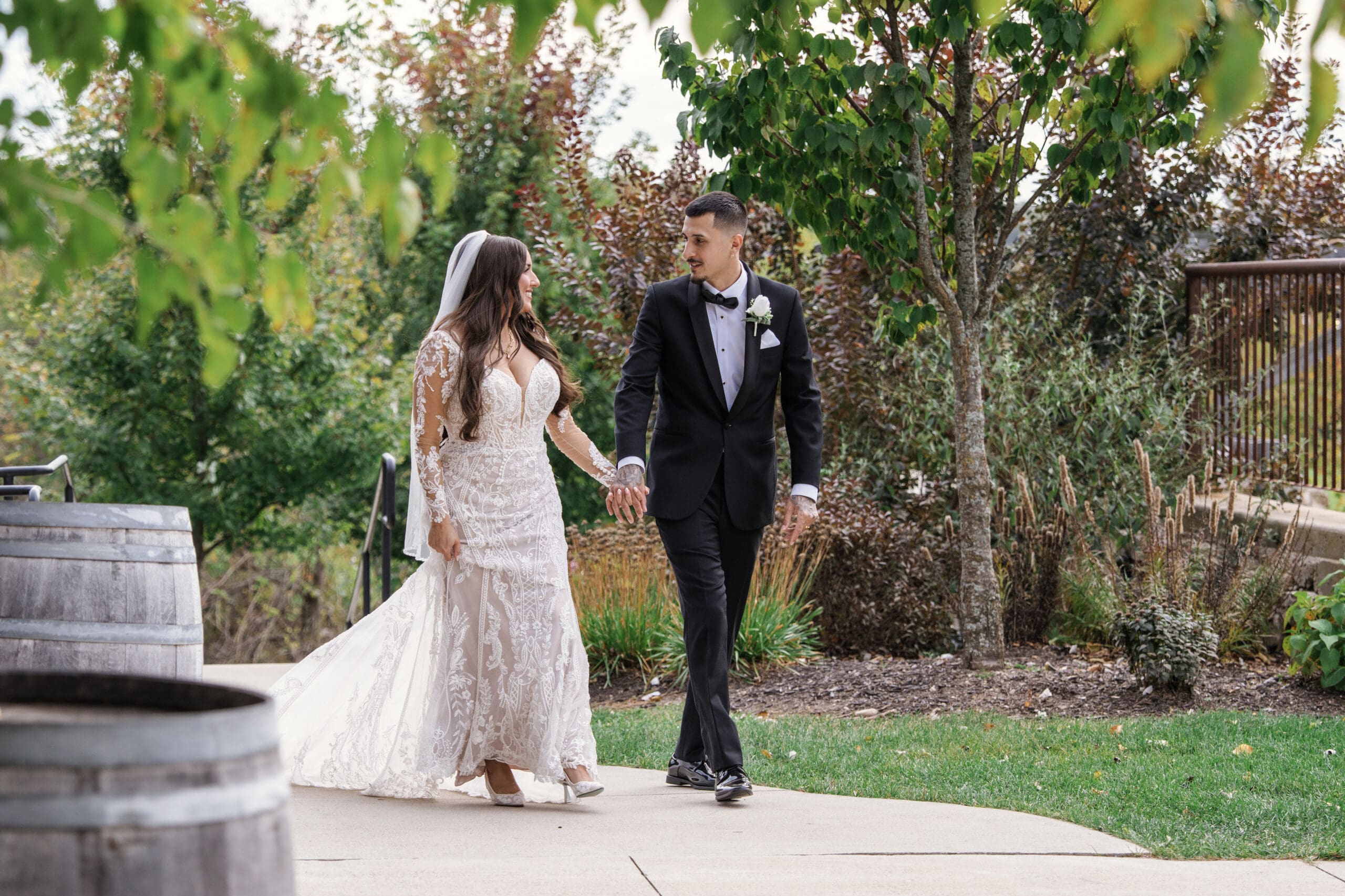 Groom and bride walking to wedding reception area