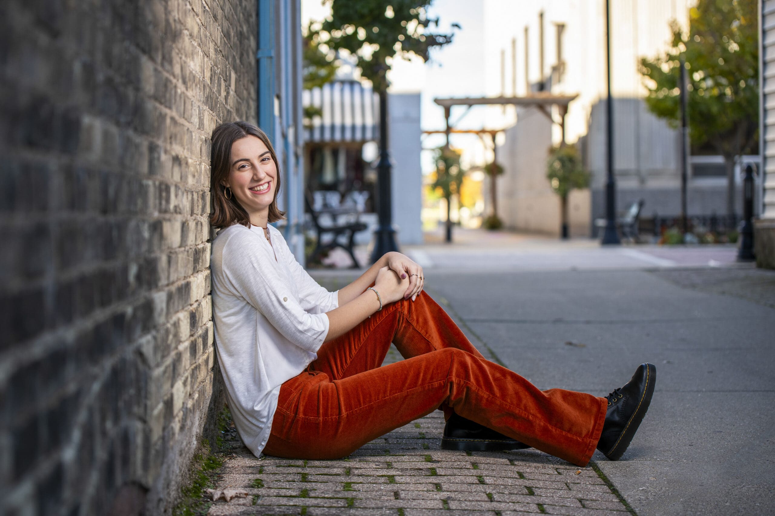 Waukesha senior sitting against wall in Oconomowoc. 