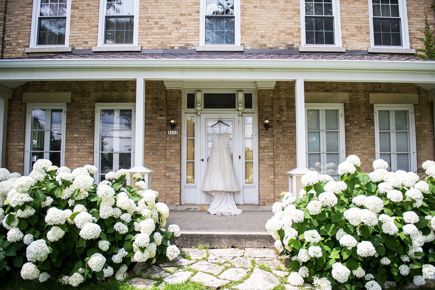 Wedding dress hanging at the Rustic Manor 1848 wedding venue