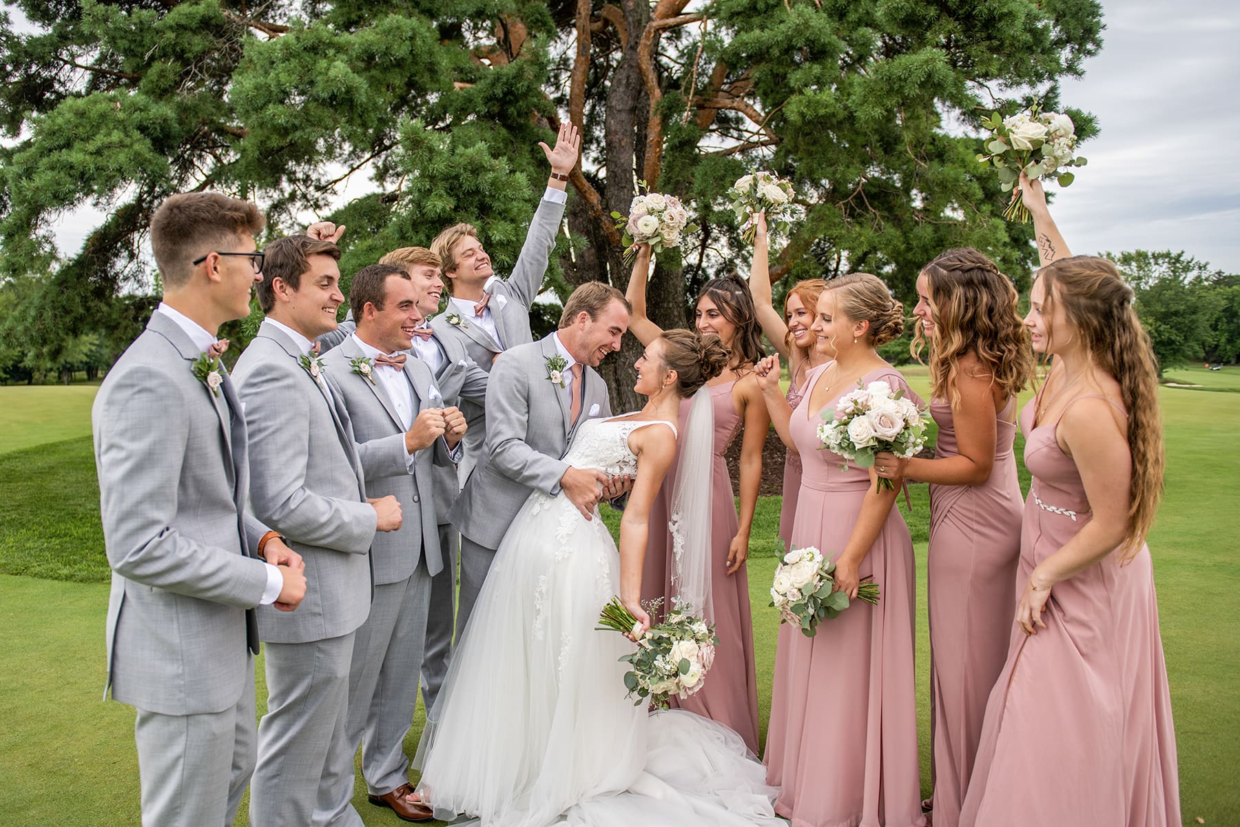 Wedding party cheering in Oconomowoc