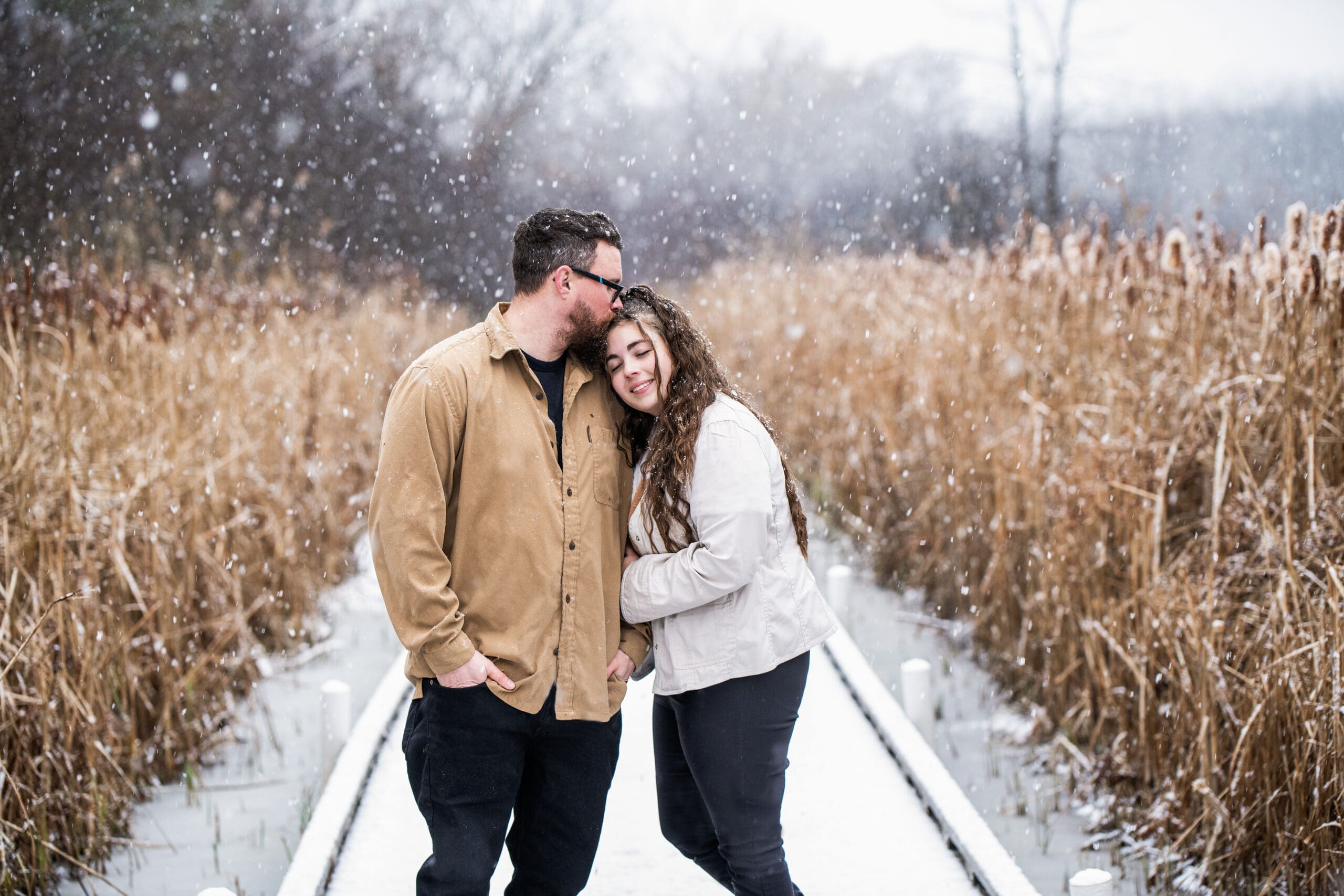 Wisconsin couple kissing in the snow during their engagement session