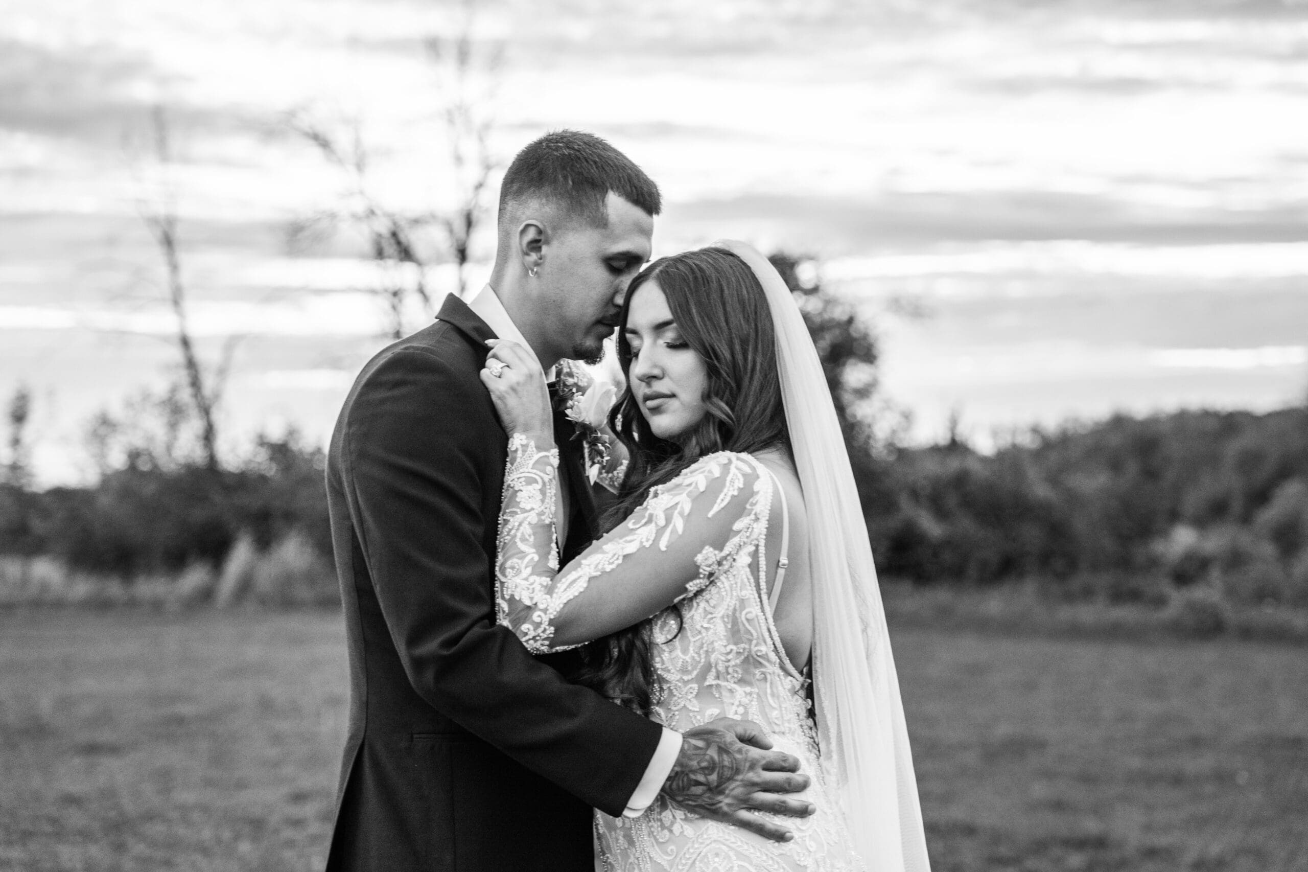 Bride and groom sharing a quiet moment together at Lilac Acres wedding venue in Wisconsin